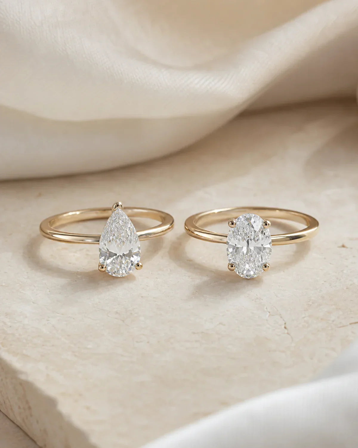 Pear cut and oval cut engagement rings visual size and sparkle comparison