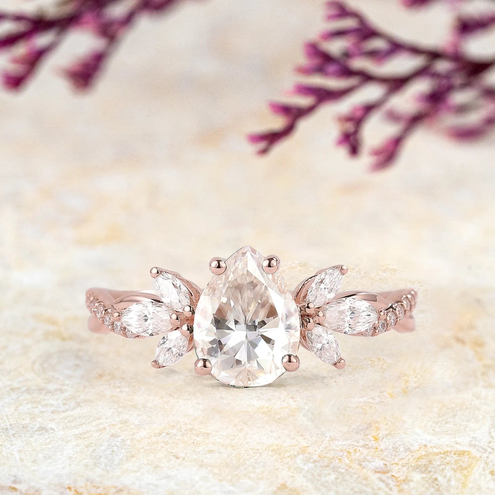 Pear-Shaped Moissanite Engagement Ring with Floral Marquise Accents 14k rose gold promise rings