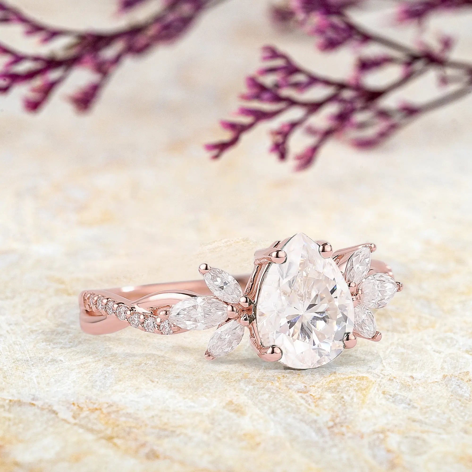 Pear-Shaped Moissanite Engagement Ring with Floral Marquise Accents 14k rose gold promise rings