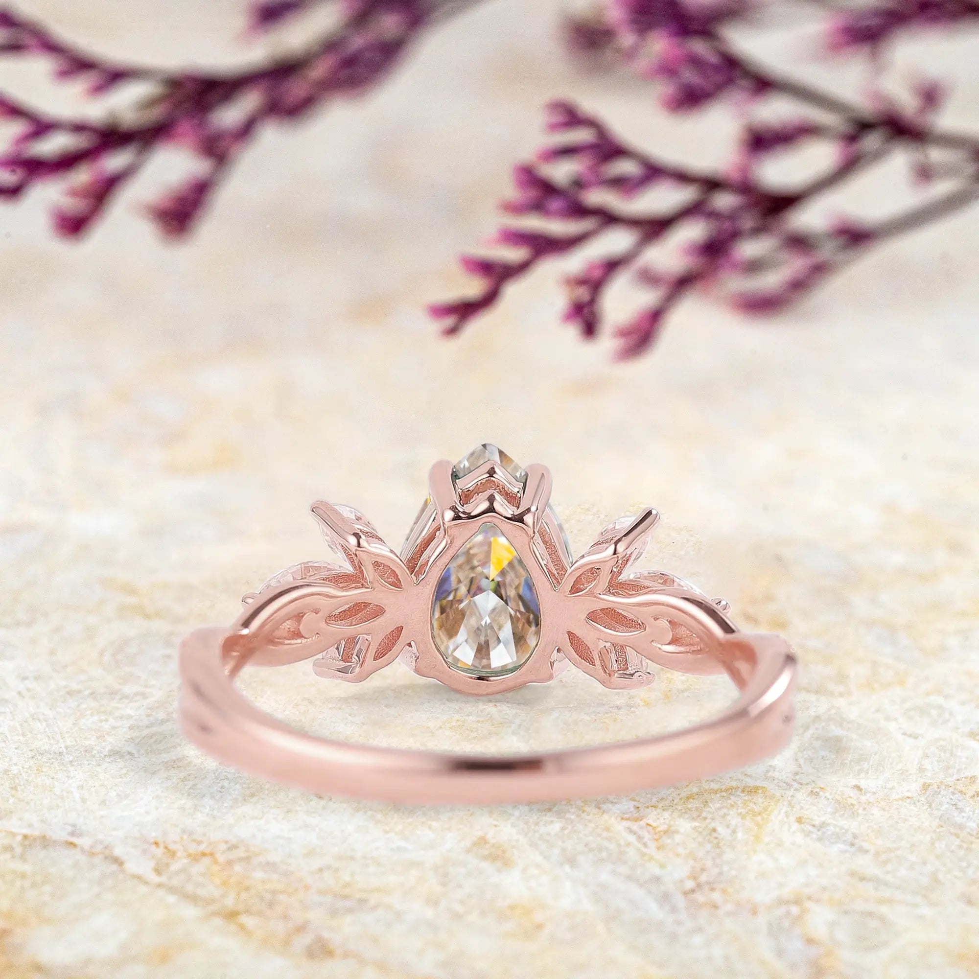 Pear-Shaped Moissanite Engagement Ring with Floral Marquise Accents 14k rose gold promise rings