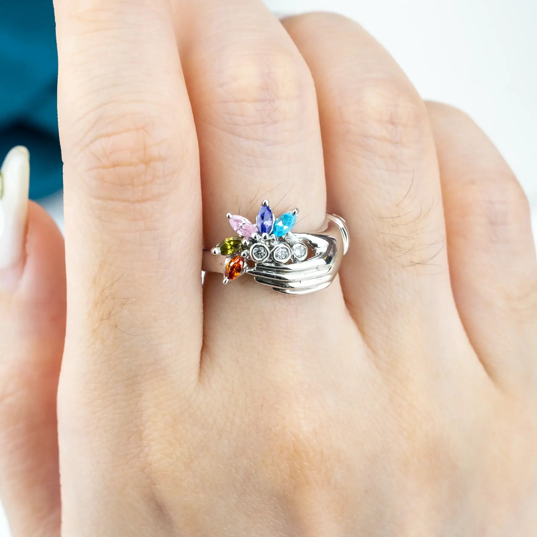 White Gold Hand Holding Colorful Gemstone Flower Ring – Artistic Statement unique band