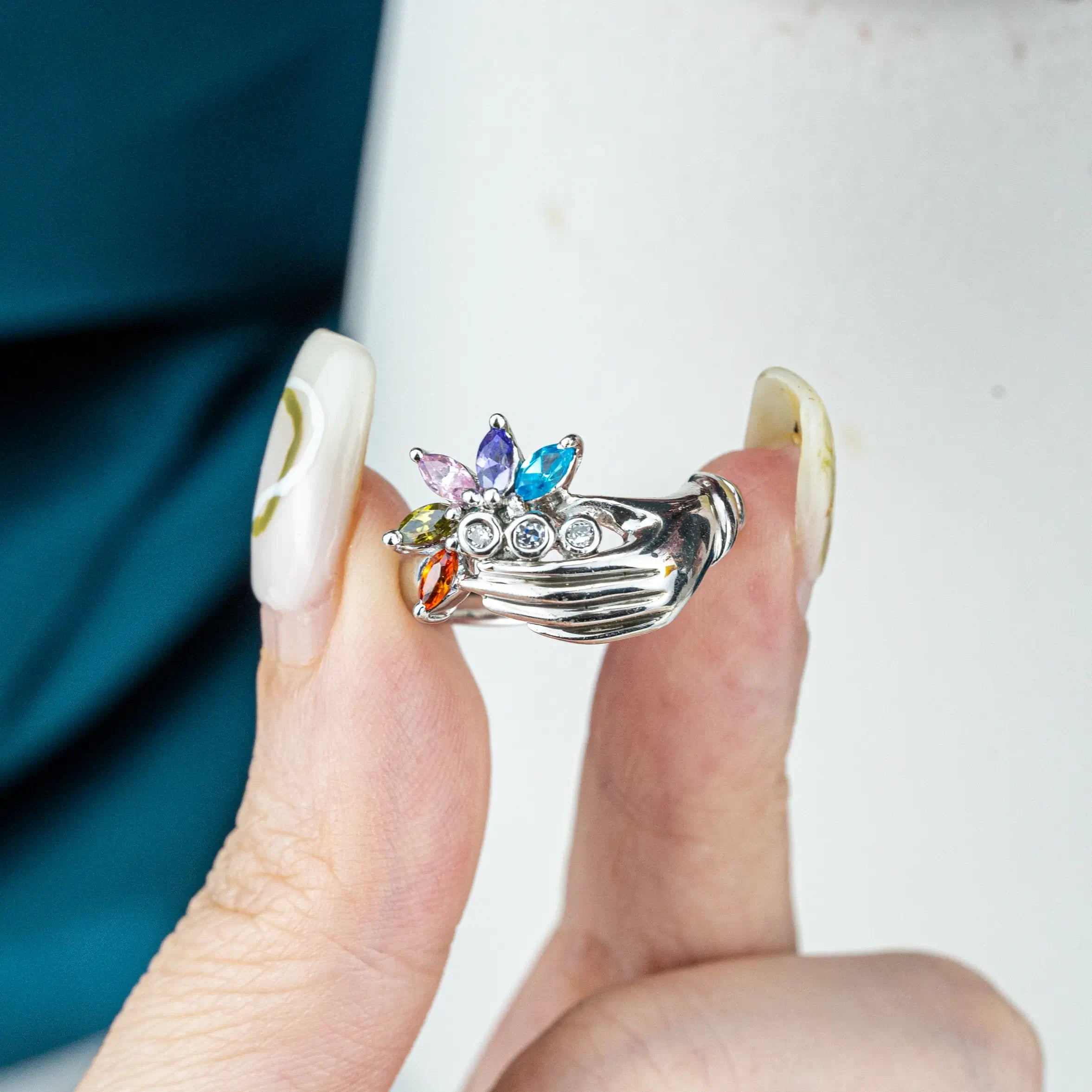White Gold Hand Holding Colorful Gemstone Flower Ring – Artistic Statement unique band