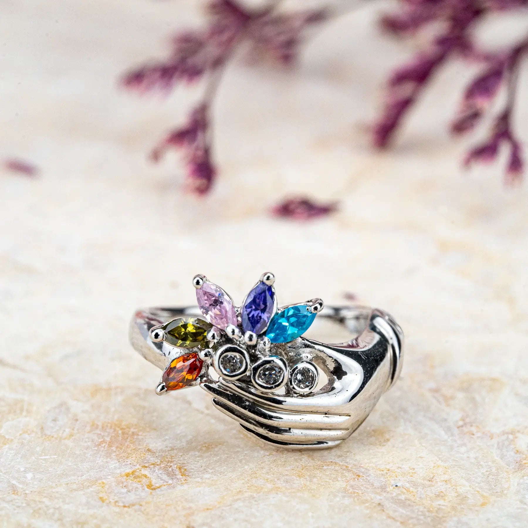 White Gold Hand Holding Colorful Gemstone Flower Ring – Artistic Statement unique band