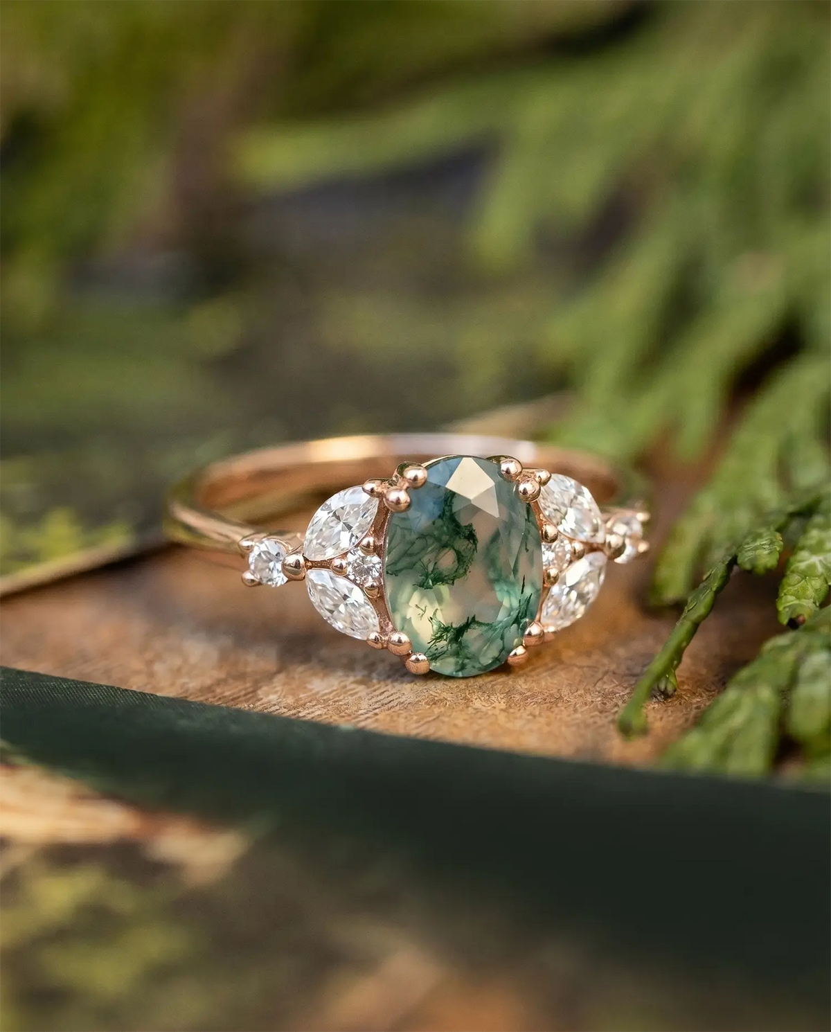 An oval-cut moss agate engagement ring 14k rose gold