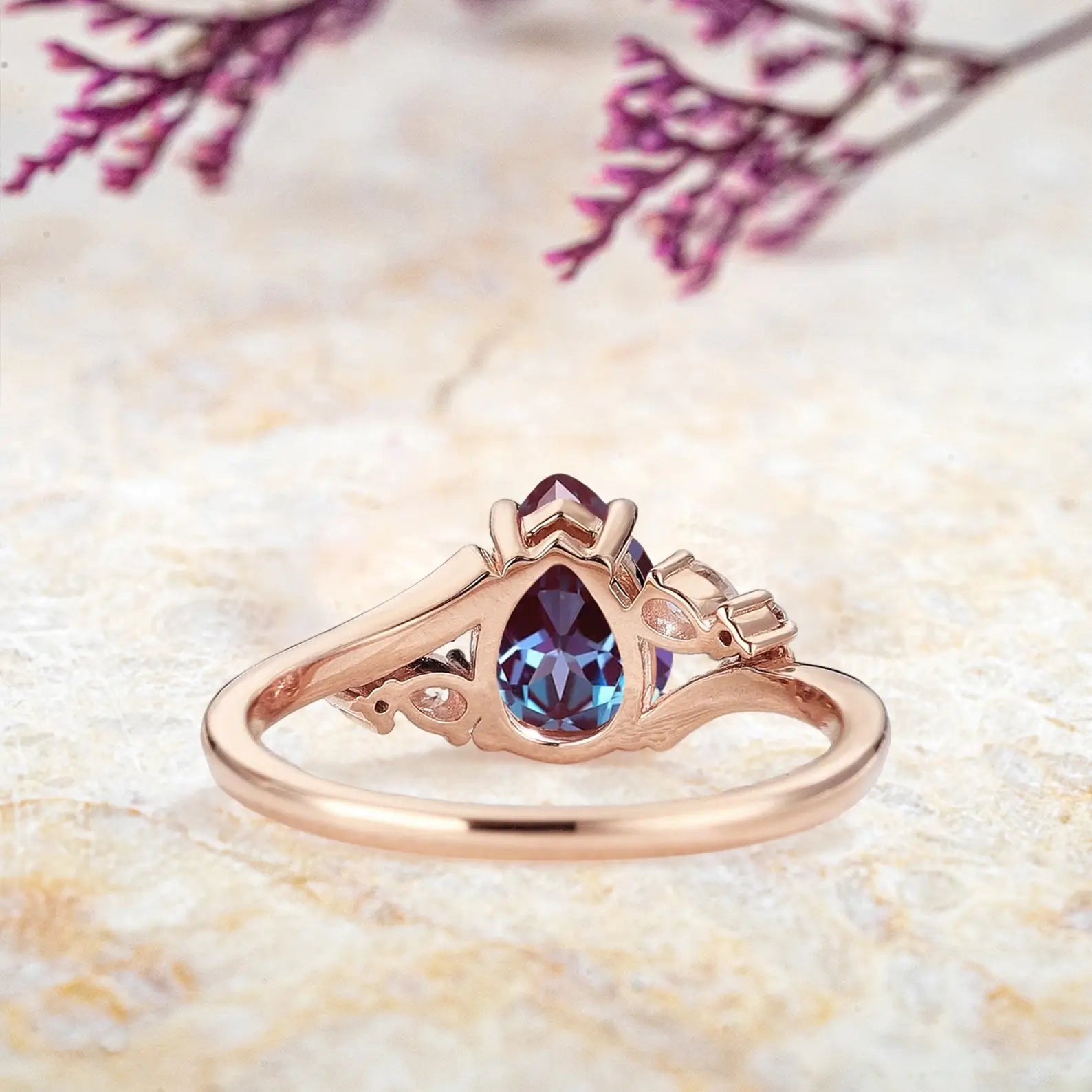 Back view of alexandrite engagement ring showing rose gold split shank band