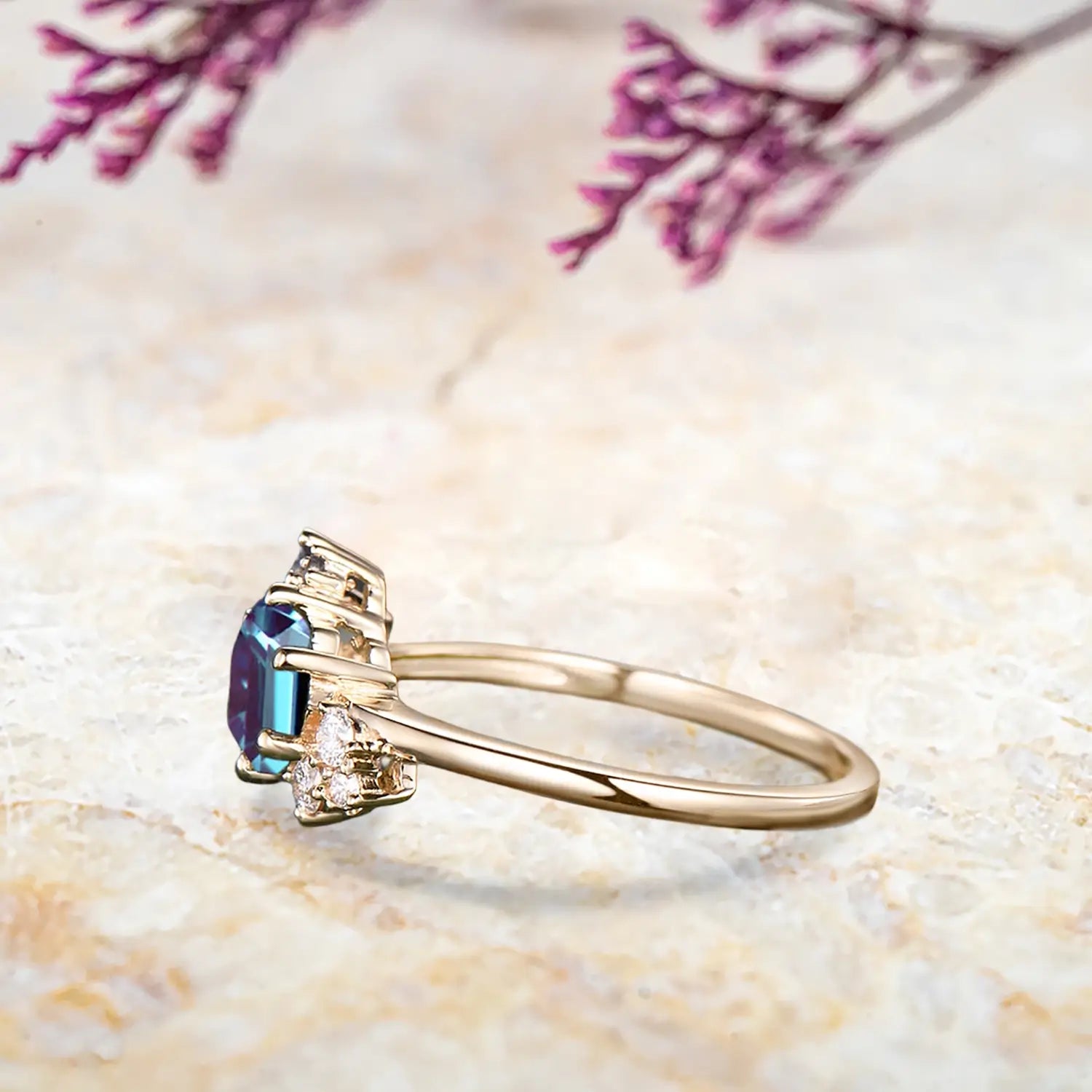 Side view of alexandrite cluster ring showing yellow gold band and hexagon stone detail