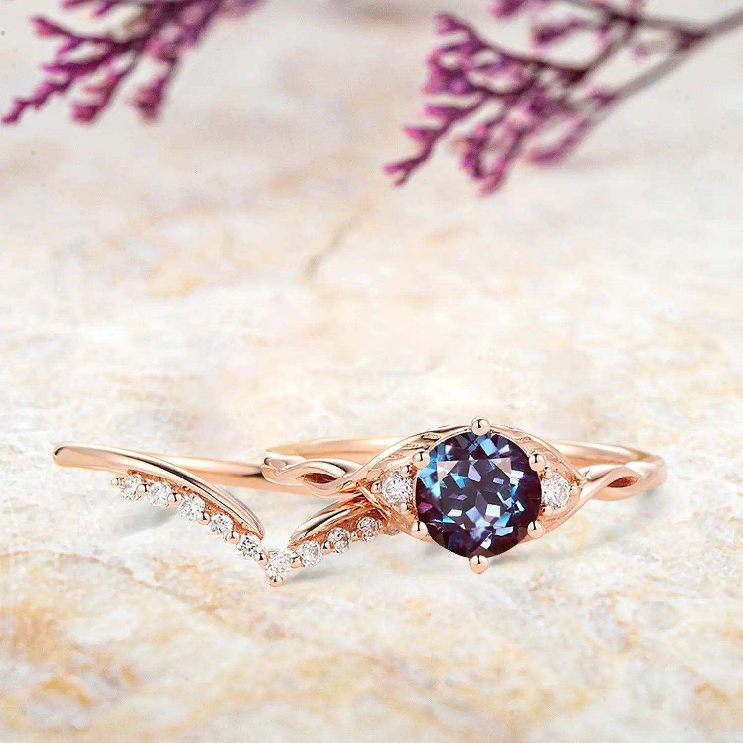 Alexandrite three stone engagement ring and chevron moissanite wedding band displayed separately showing June birthstone bridal set