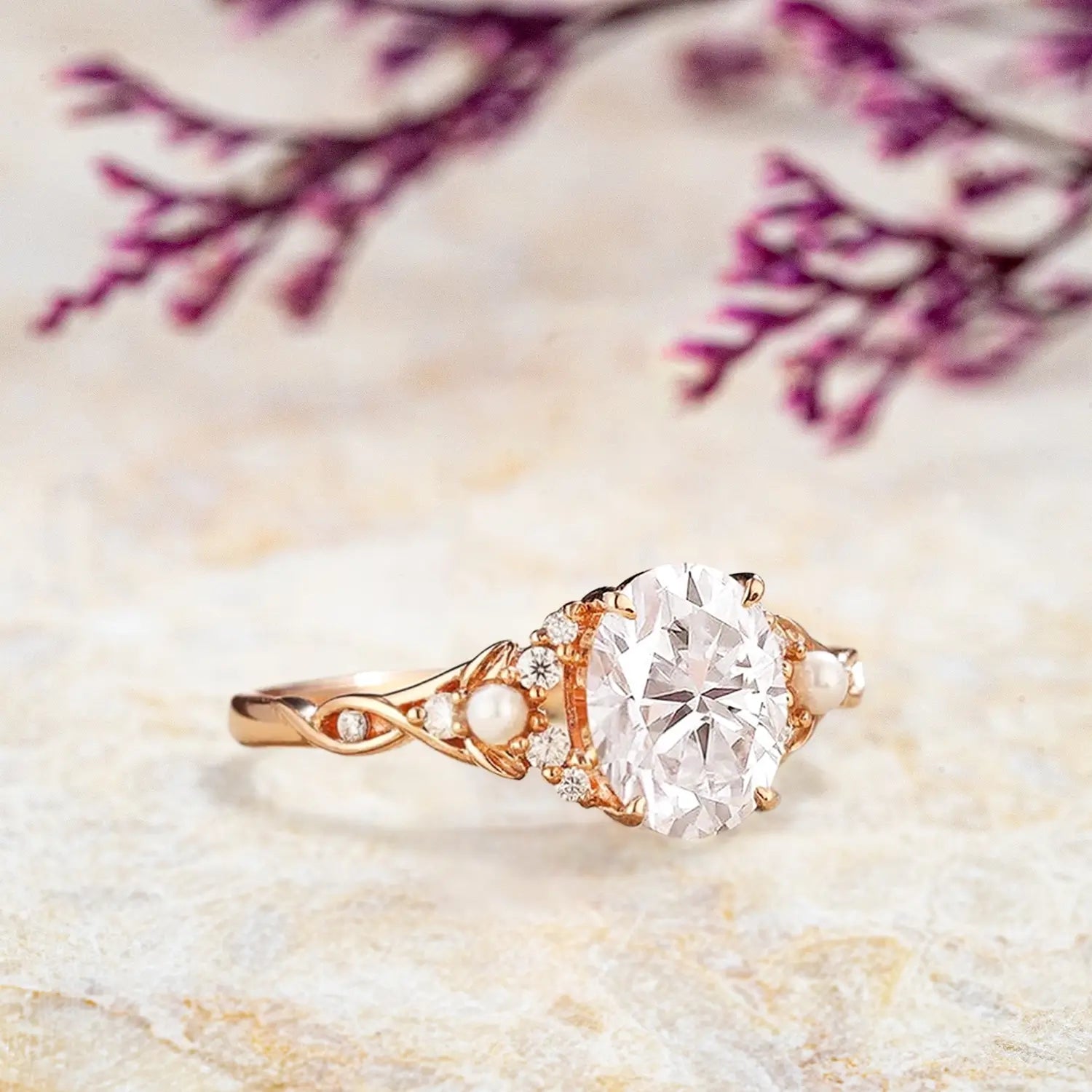 Side view of oval moissanite ring showing art deco floral cluster with pearls and twisted branch band
