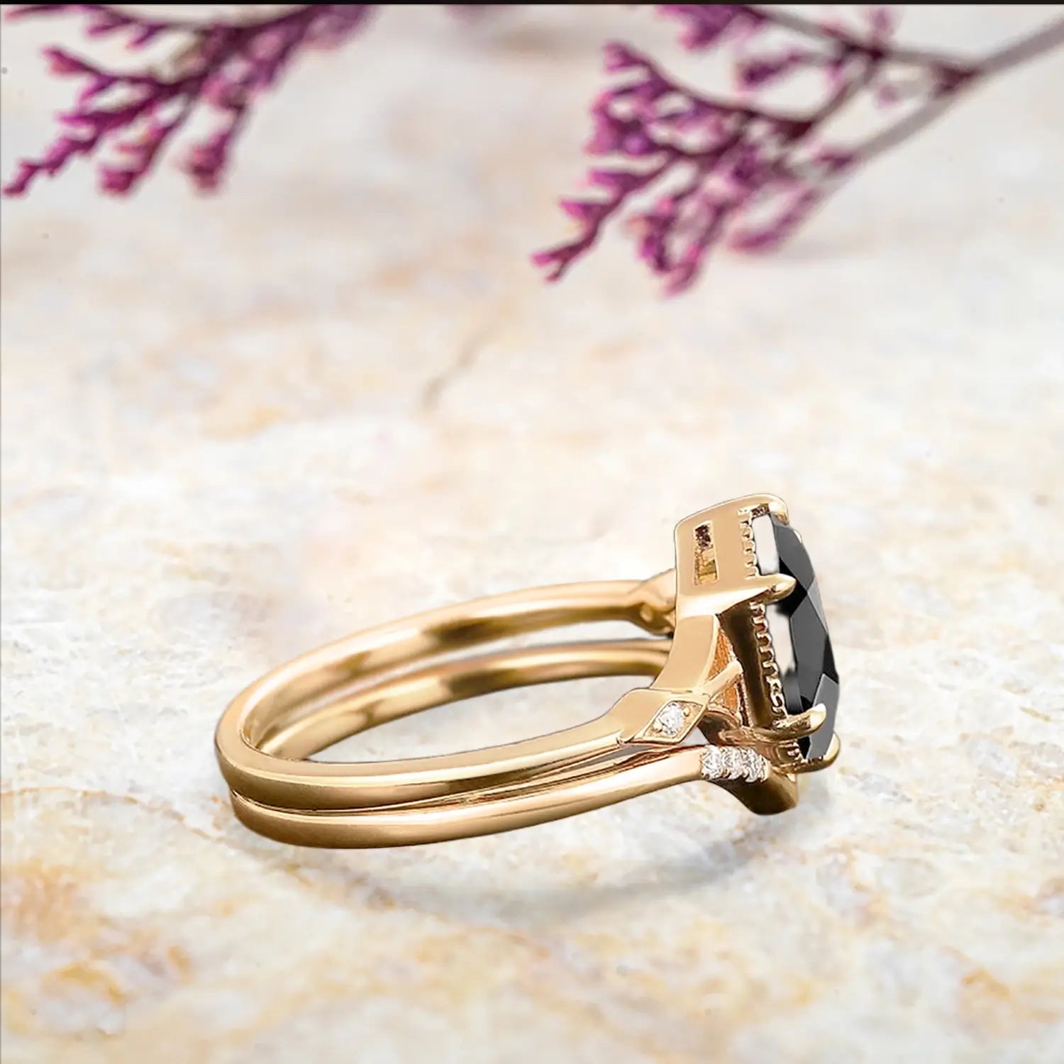 Side view of black onyx bridal set showing yellow gold chevron band and milgrain details