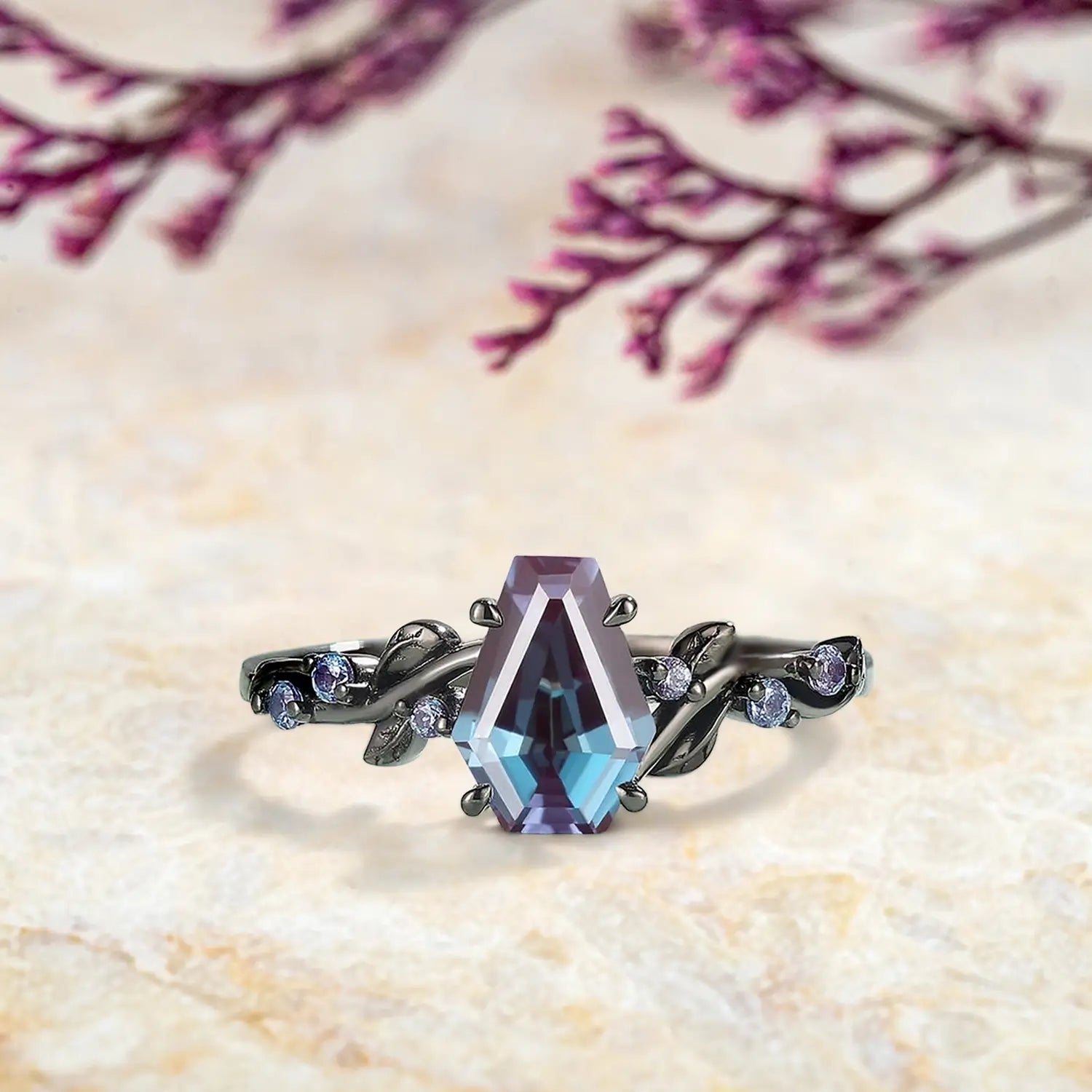 Coffin cut alexandrite engagement ring with nature inspired leaf band in black gold gothic design