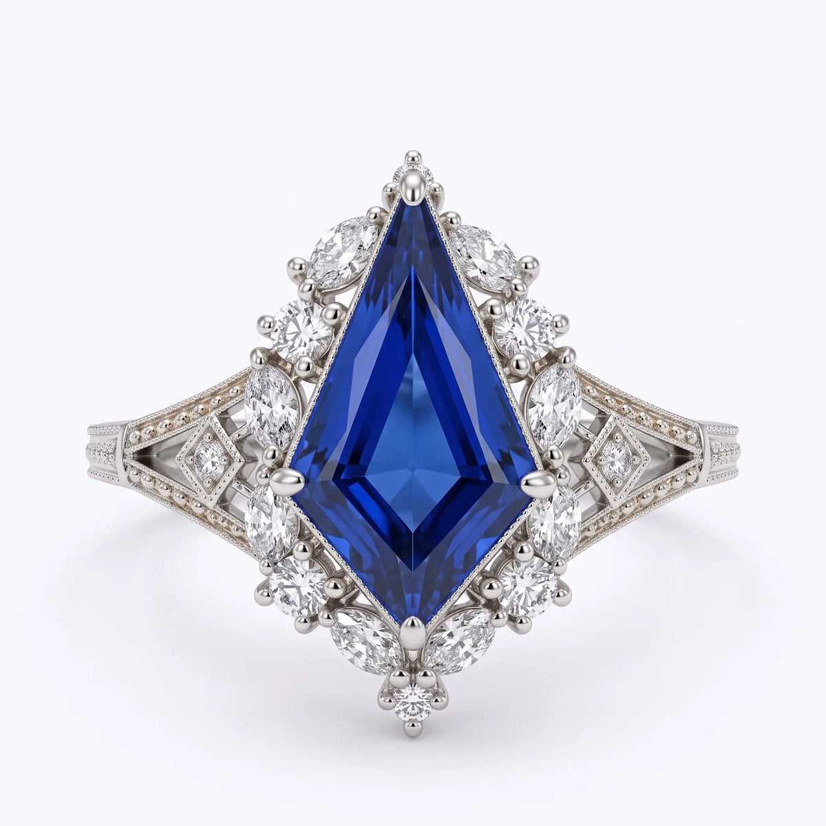Front view of Elarisse vintage Edwardian engagement ring with elongated royal blue kite cut lab sapphire, geometric moissanite halo and white gold openwork band.