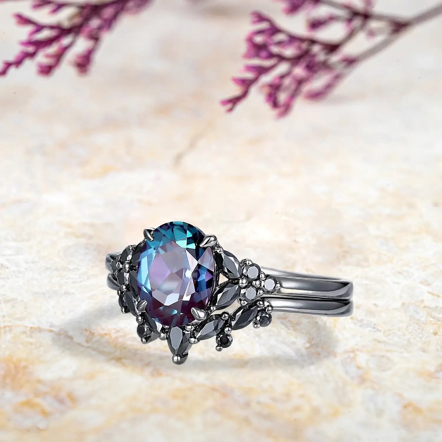 Side view of oval alexandrite ring showing black onyx marquise cluster design and curved chevron wedding band profile