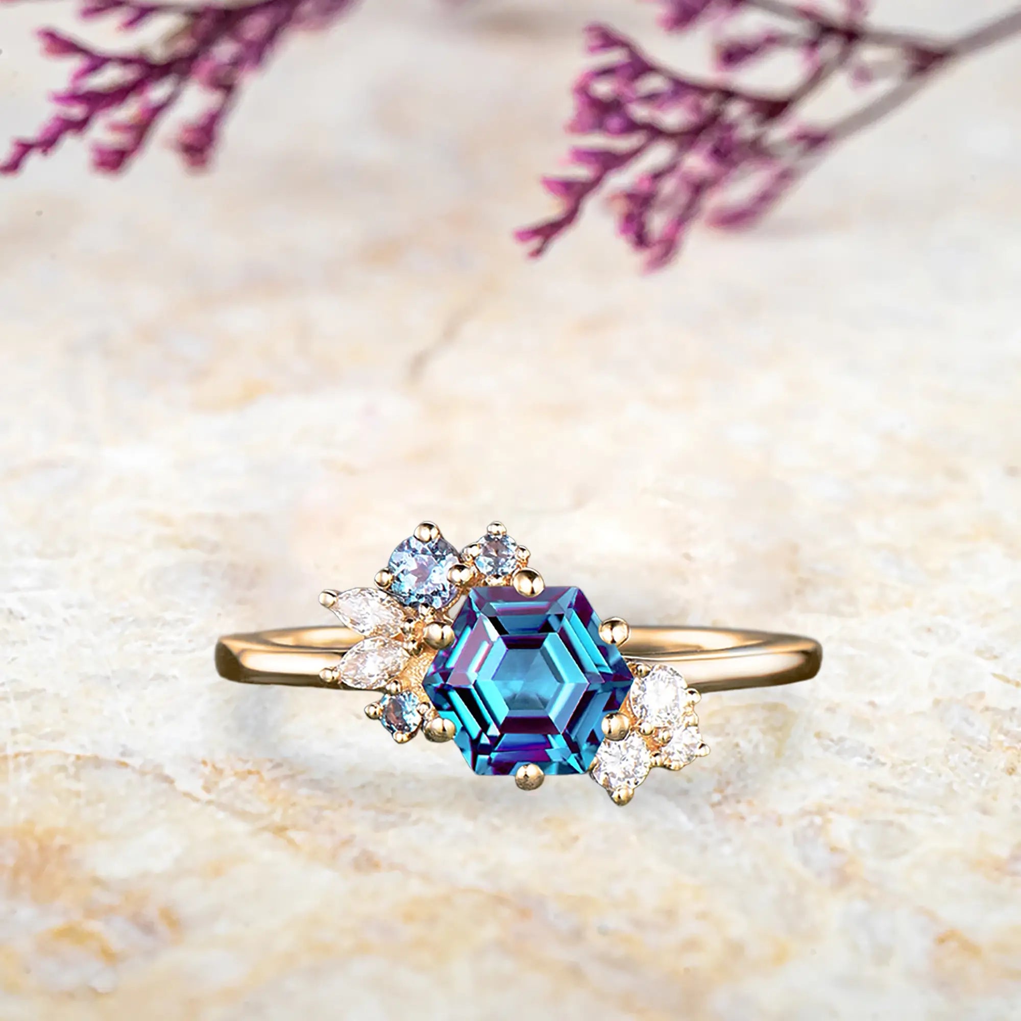 Hexagon alexandrite engagement ring in yellow gold with diamond cluster Art Deco design