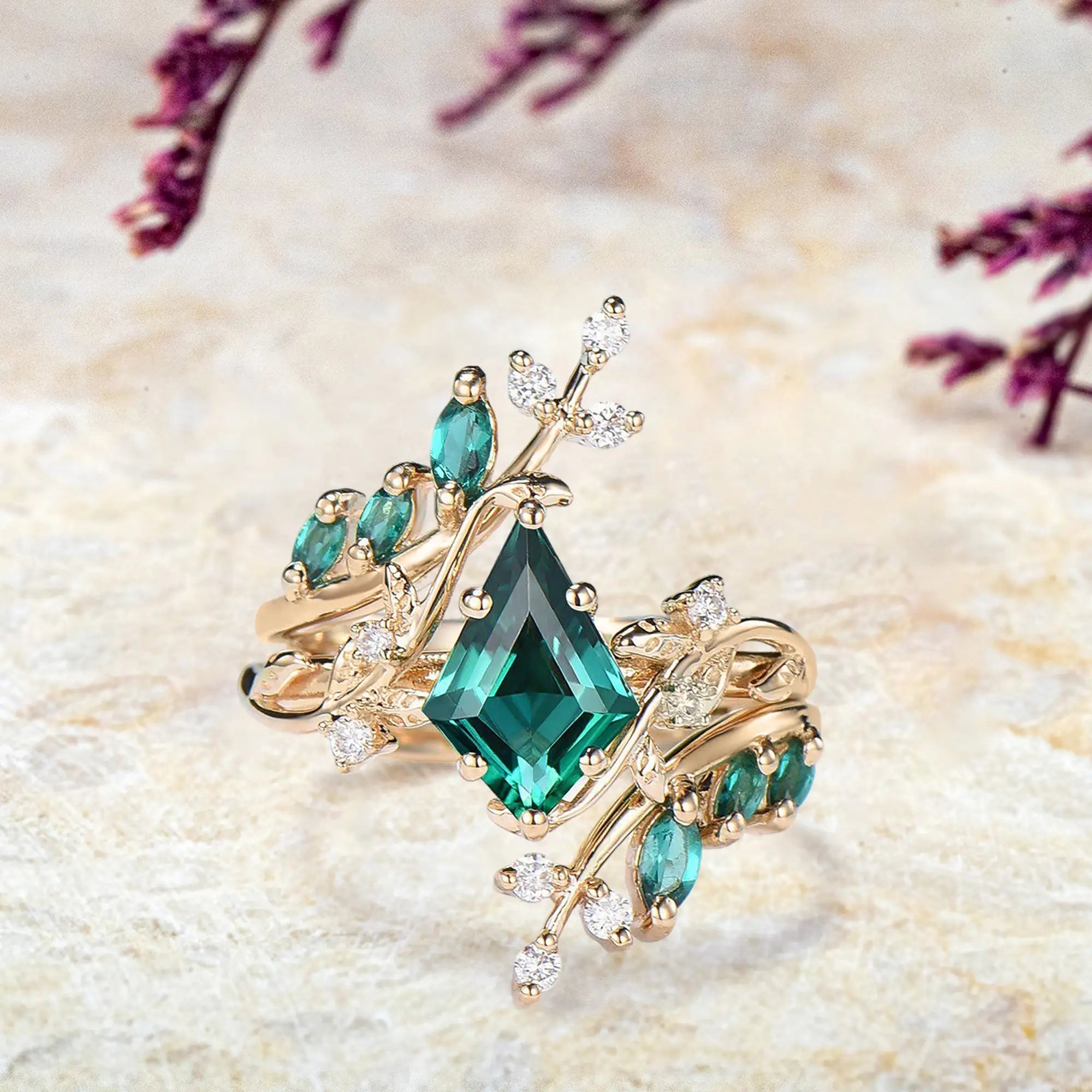 Kite emerald bridal set in yellow gold with leafy cluster design and diamond accents