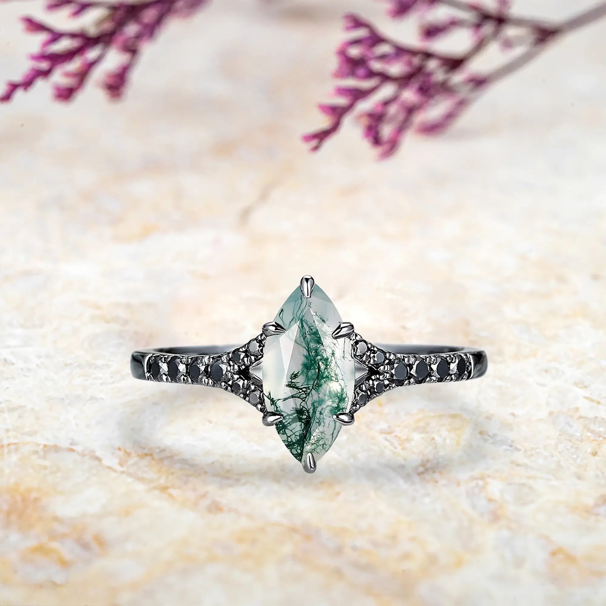 Marquise moss agate engagement ring with nature inspired split shank and black moissanite pavé in black gold