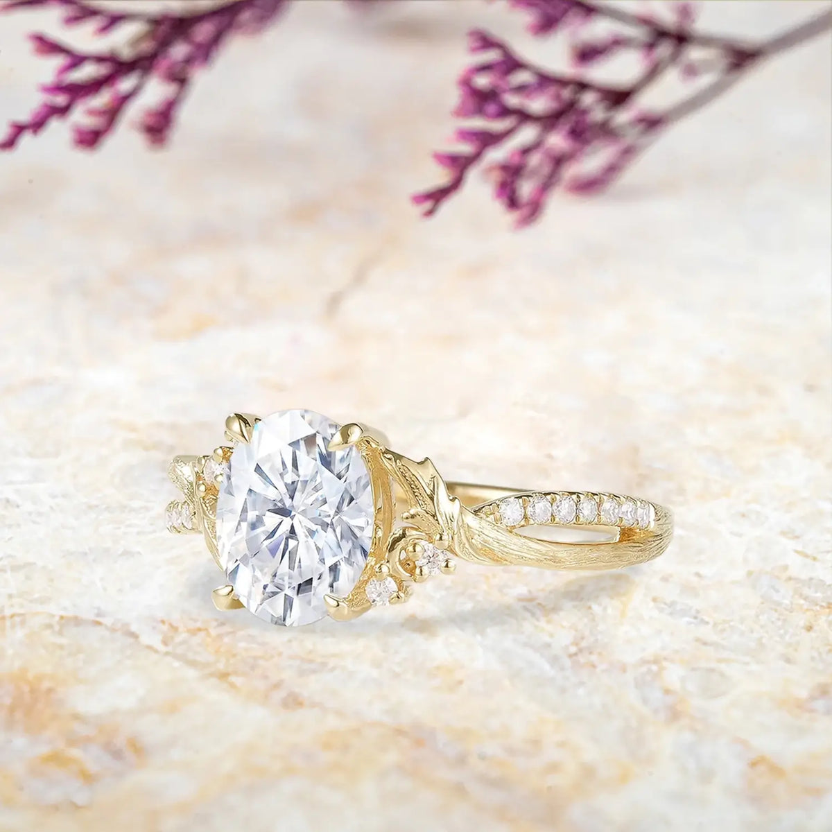 Woman wearing oval moissanite yellow gold engagement ring with tree bark texture