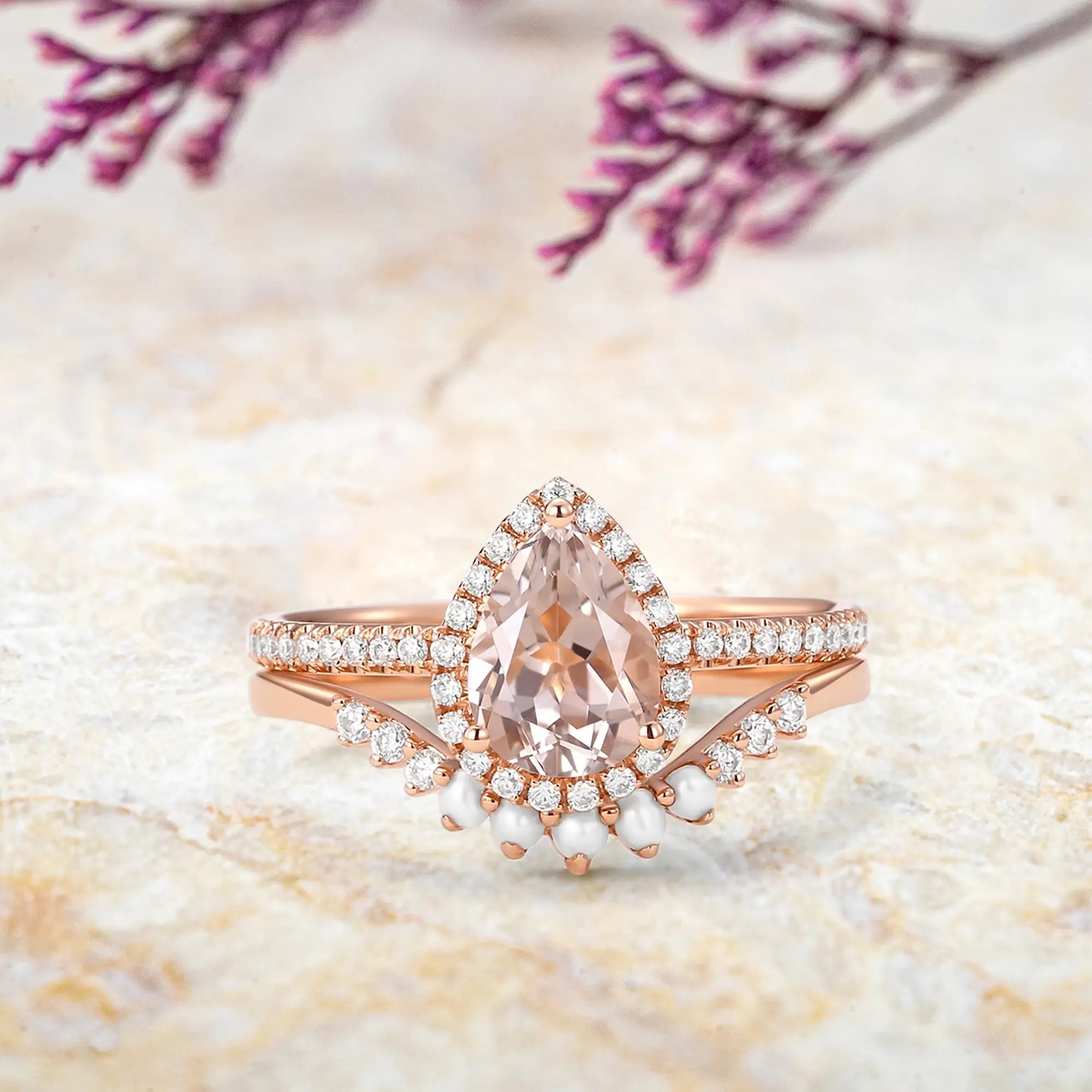 pear shaped morganite engagement ring set in 14k rose gold with halo and pearls orleone