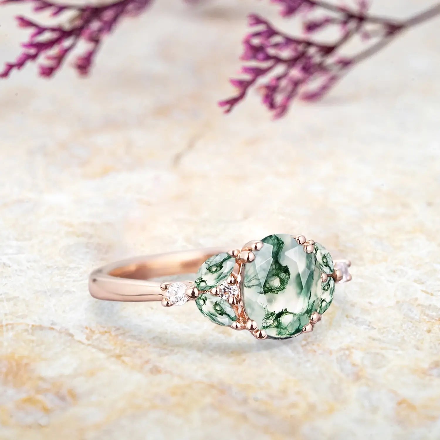 Side view of moss agate cluster ring showing rose gold band and marquise stone arrangement orleone ring
