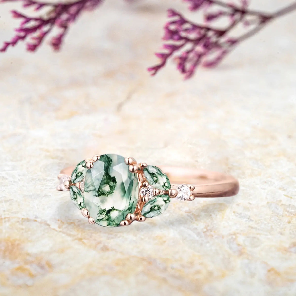 Side view of moss agate cluster ring showing rose gold band and marquise stone arrangement orleone ring