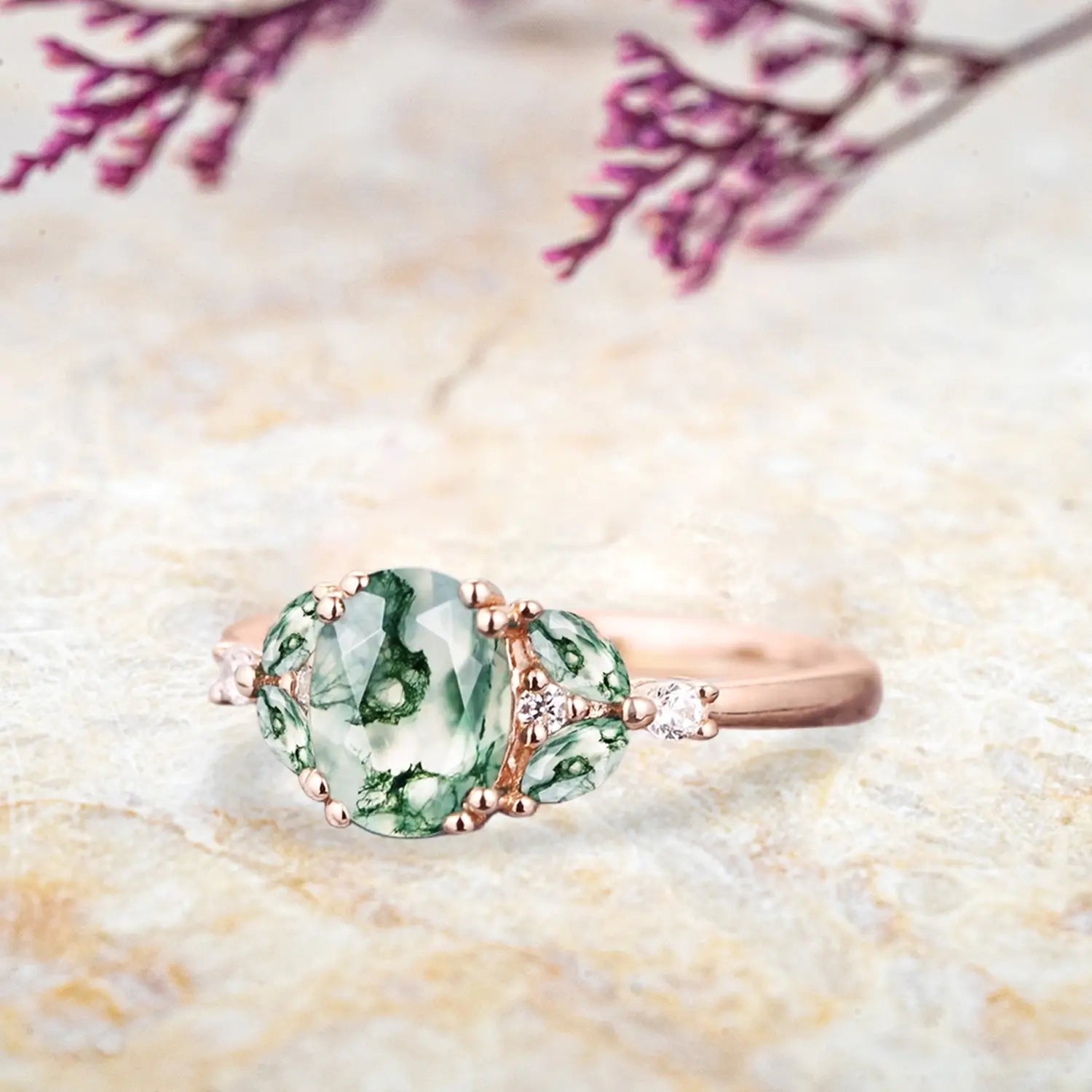 Side view of moss agate cluster ring showing rose gold band and marquise stone arrangement orleone ring