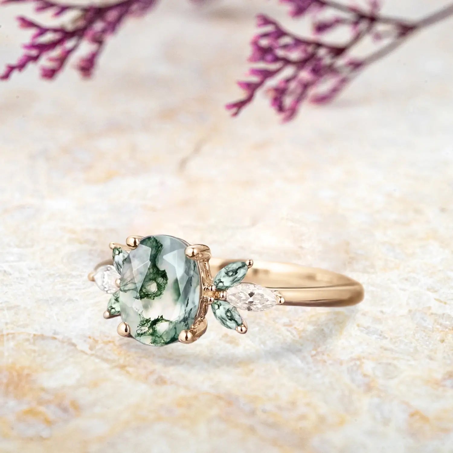 Side view of moss agate cluster ring showing rose gold band and marquise stone details