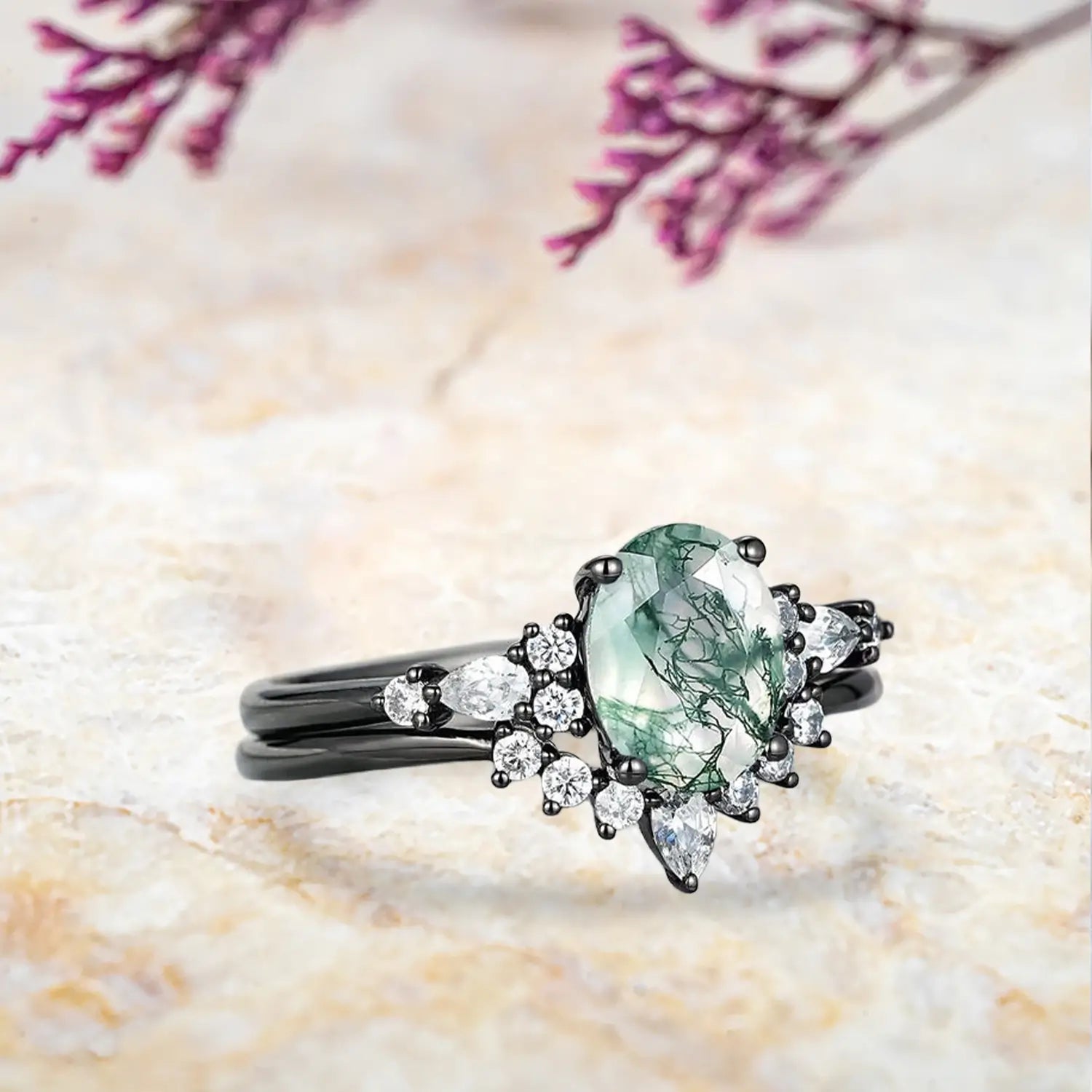 Side view of moss agate bridal set showing black gold band and moissanite details