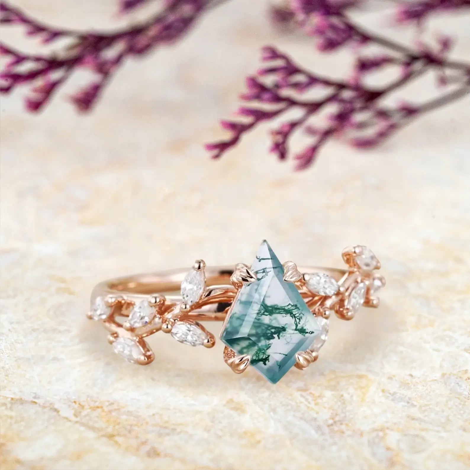 Side view of moss agate ring showing rose gold leaf clusters and marquise stones