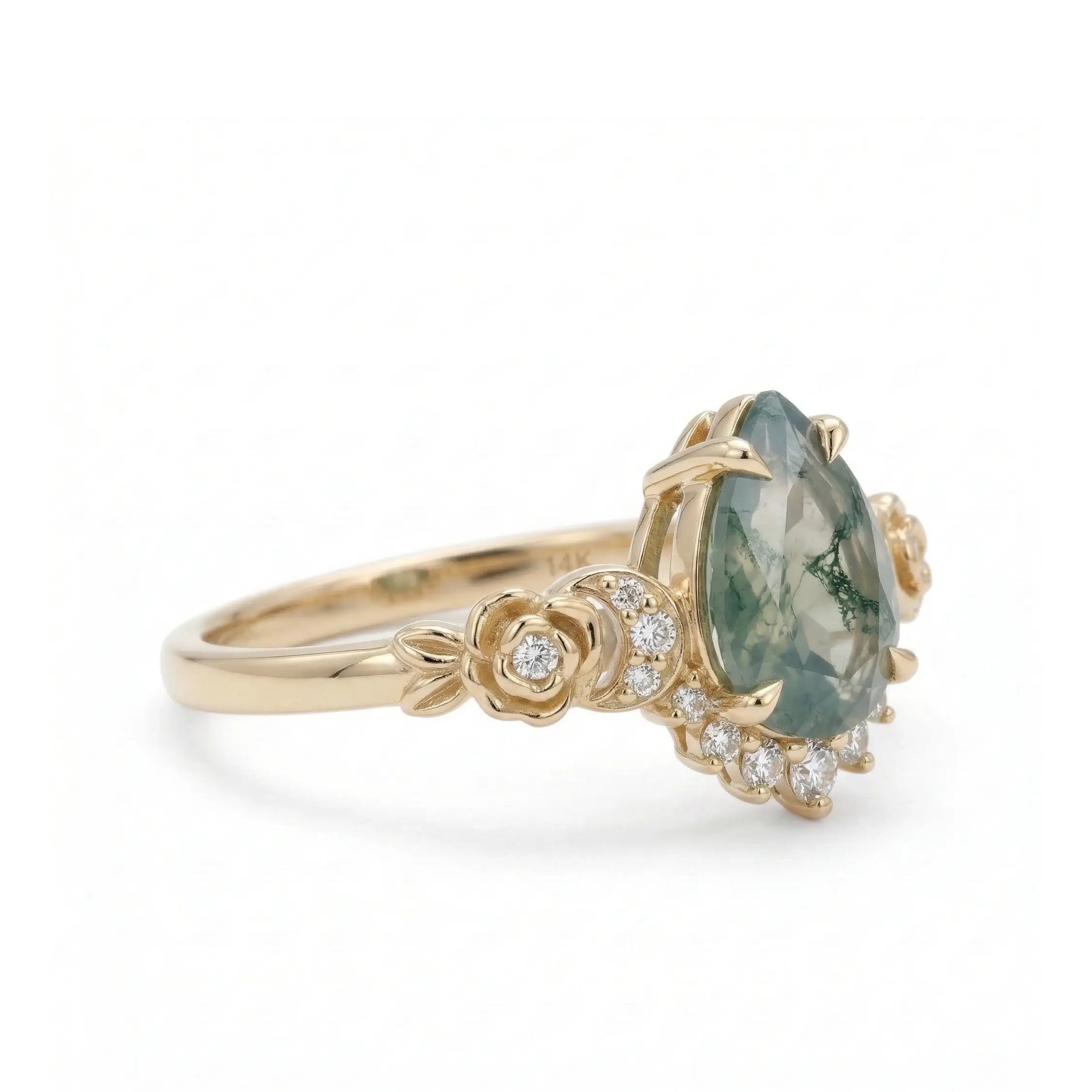 natural pear moss agate engagement ring close up showing green inclusions floral rose