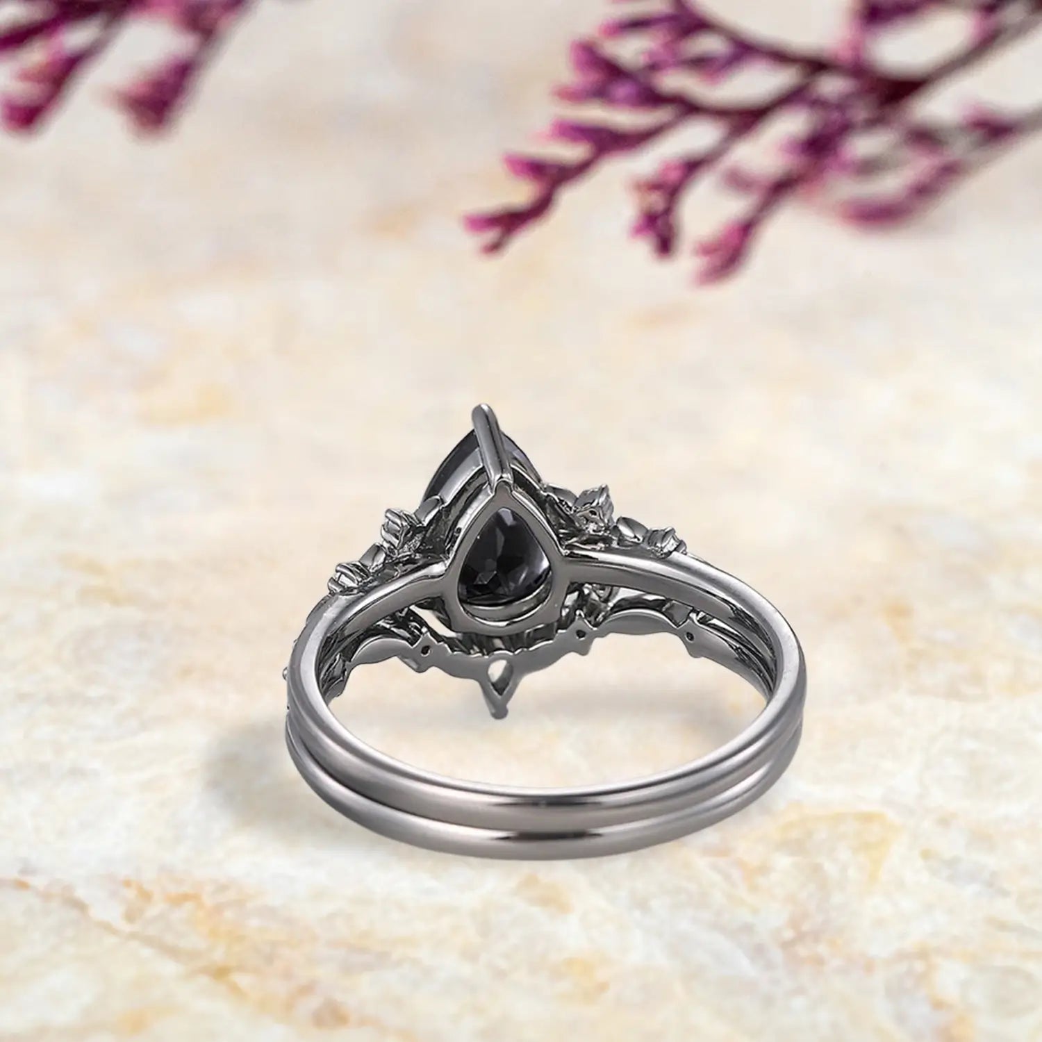 Back view of Gothic black onyx engagement ring set showing nature inspired floral cluster and curved leaf wedding band craftsmanship