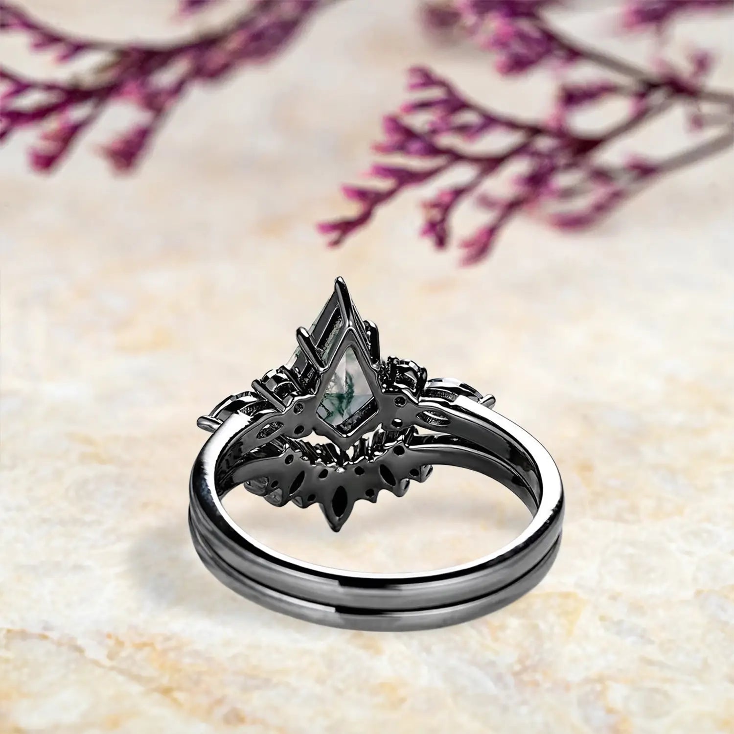 Back view of luxury moss agate engagement ring set showing nature inspired cluster and chevron wedding band craftsmanship in black gold