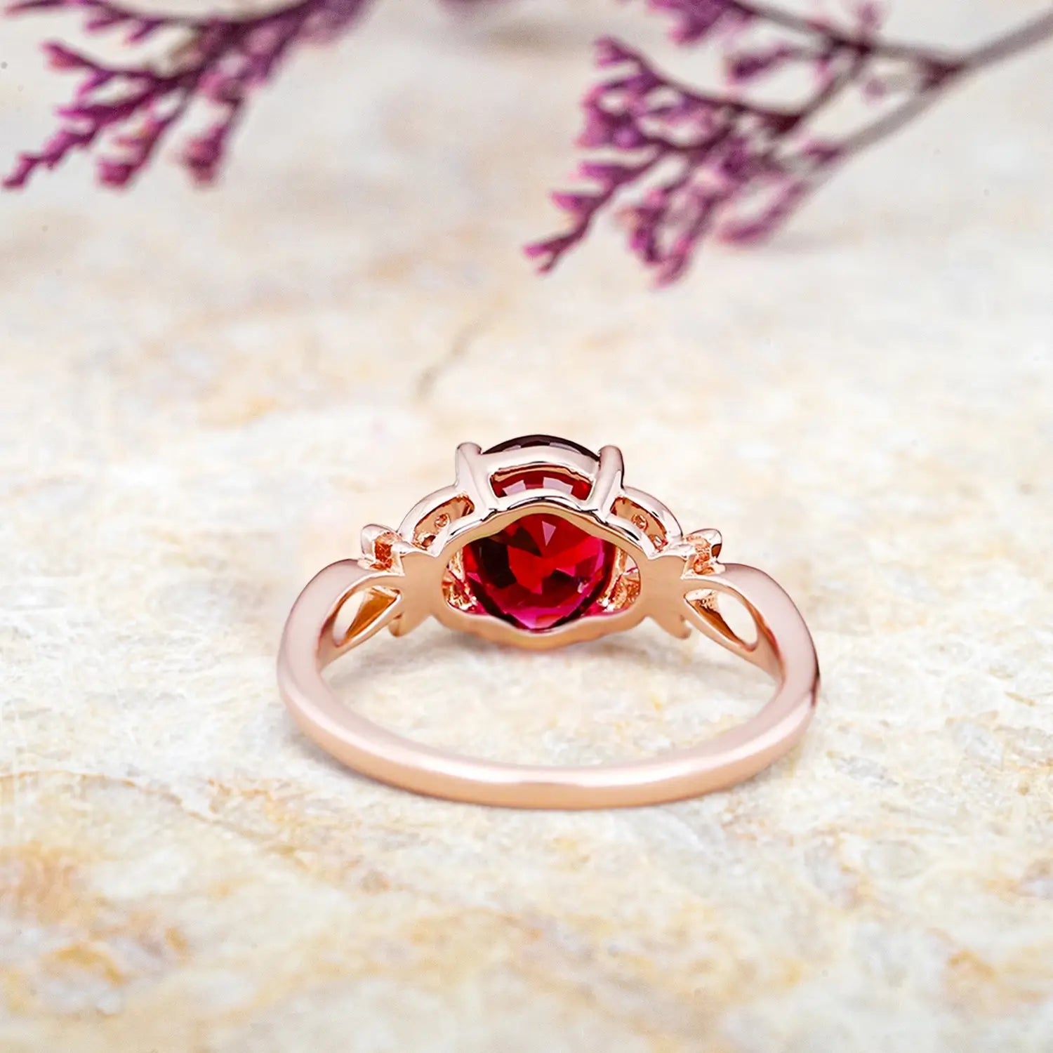 Back view of nature inspired ruby engagement ring showing butterfly floral band craftsmanship in rose gold