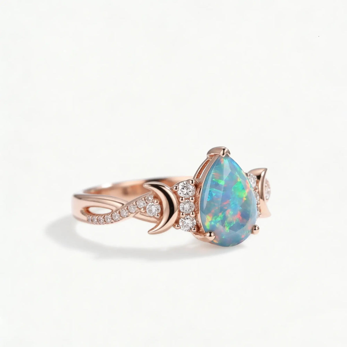 pear cut opal ring with moissanite pave twisted band