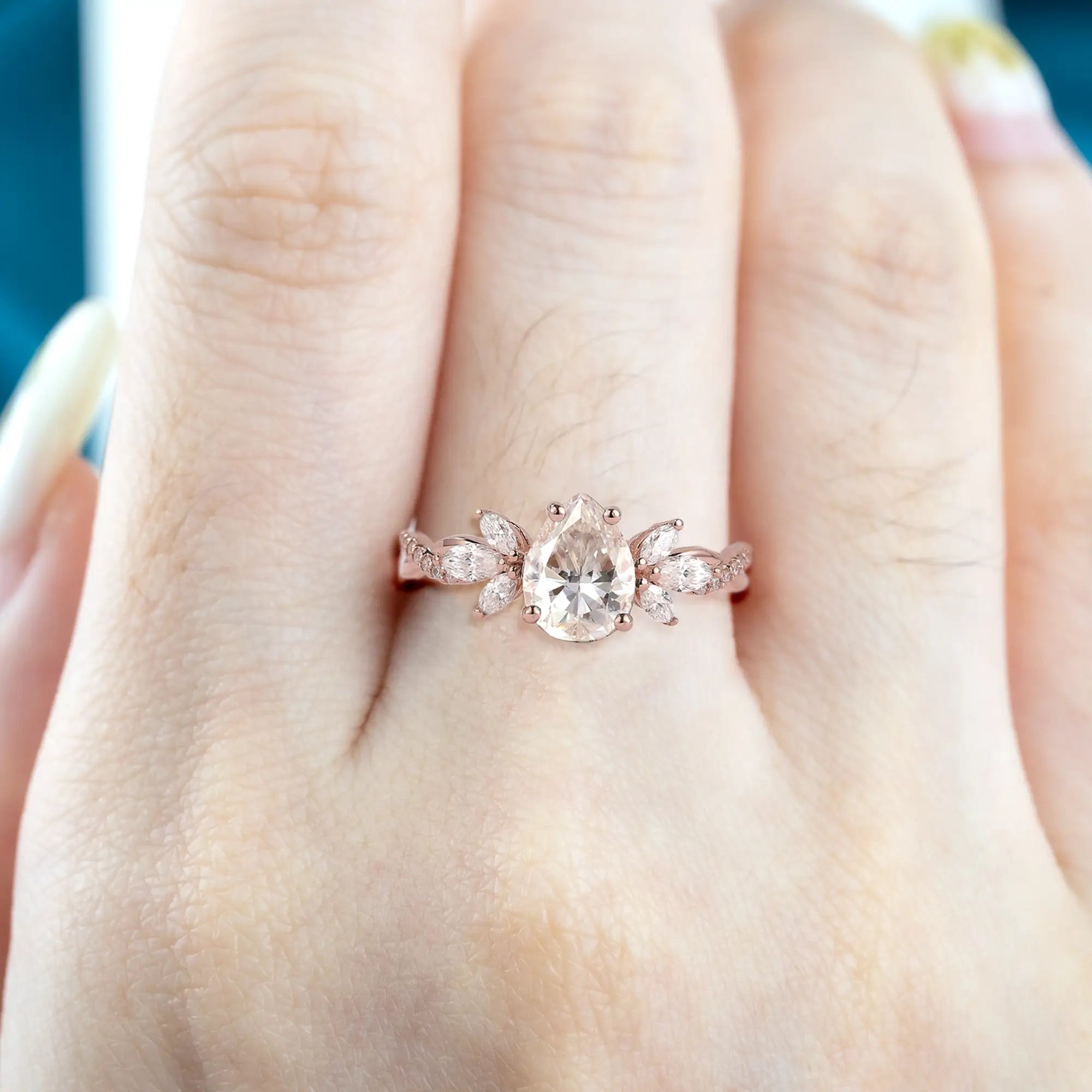 Pear-Shaped Moissanite Engagement Ring with Floral Marquise Accents 14k rose gold promise rings