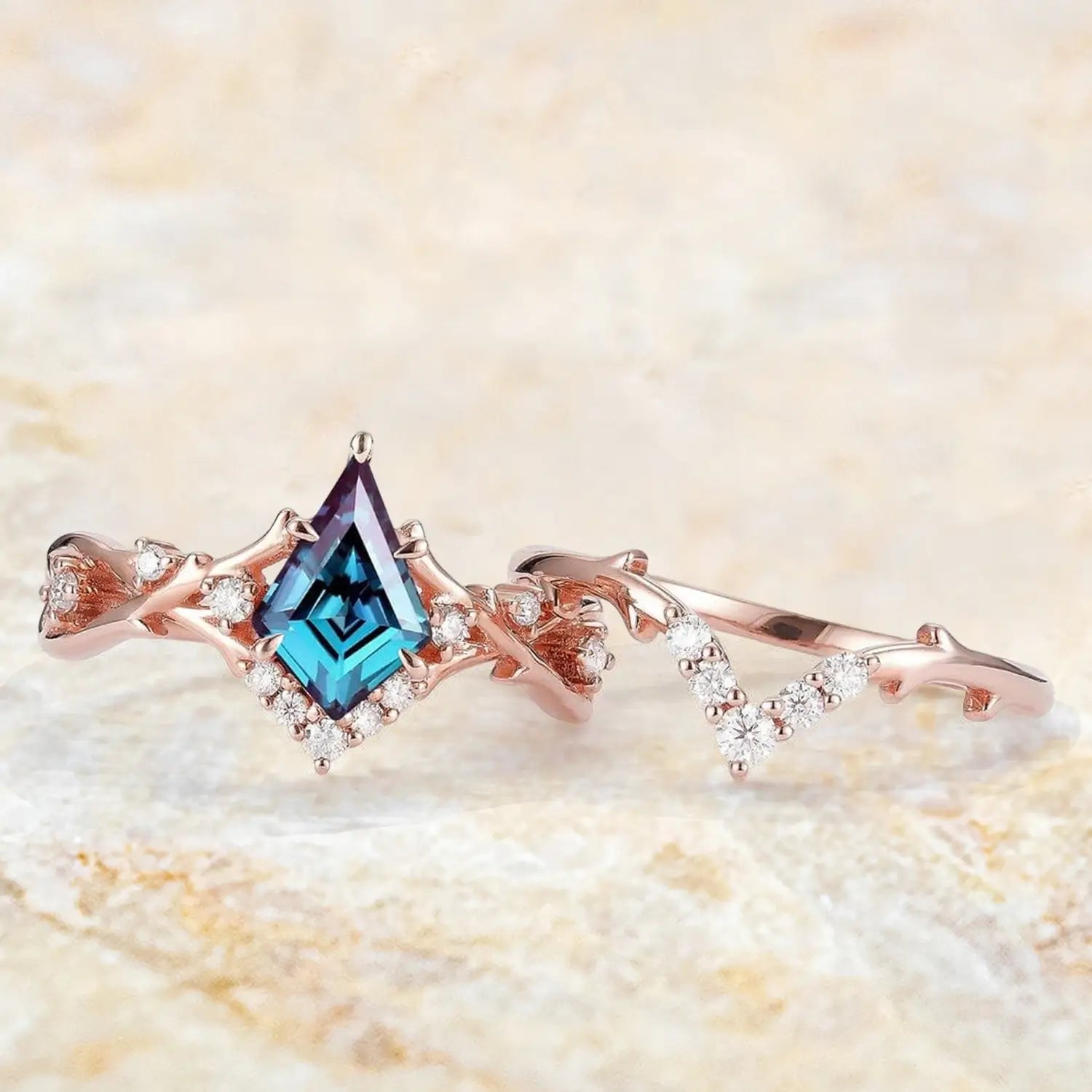 Kite cut alexandrite engagement ring and moissanite wedding band shown separately