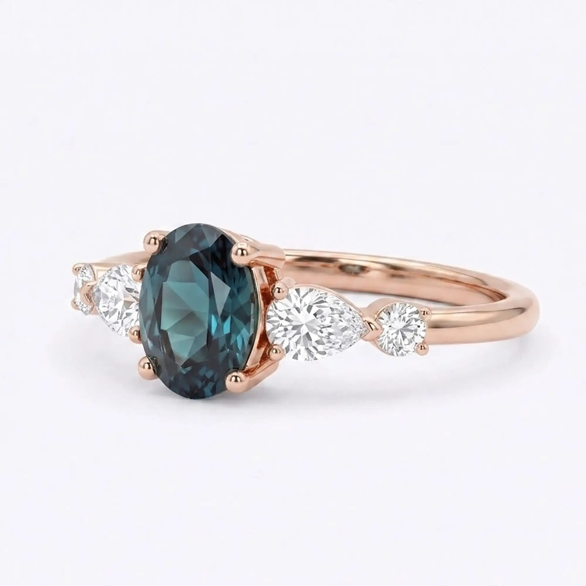 Side view of a thin gold alexandrite ring band showing low-profile prong work and secure gemstone placement