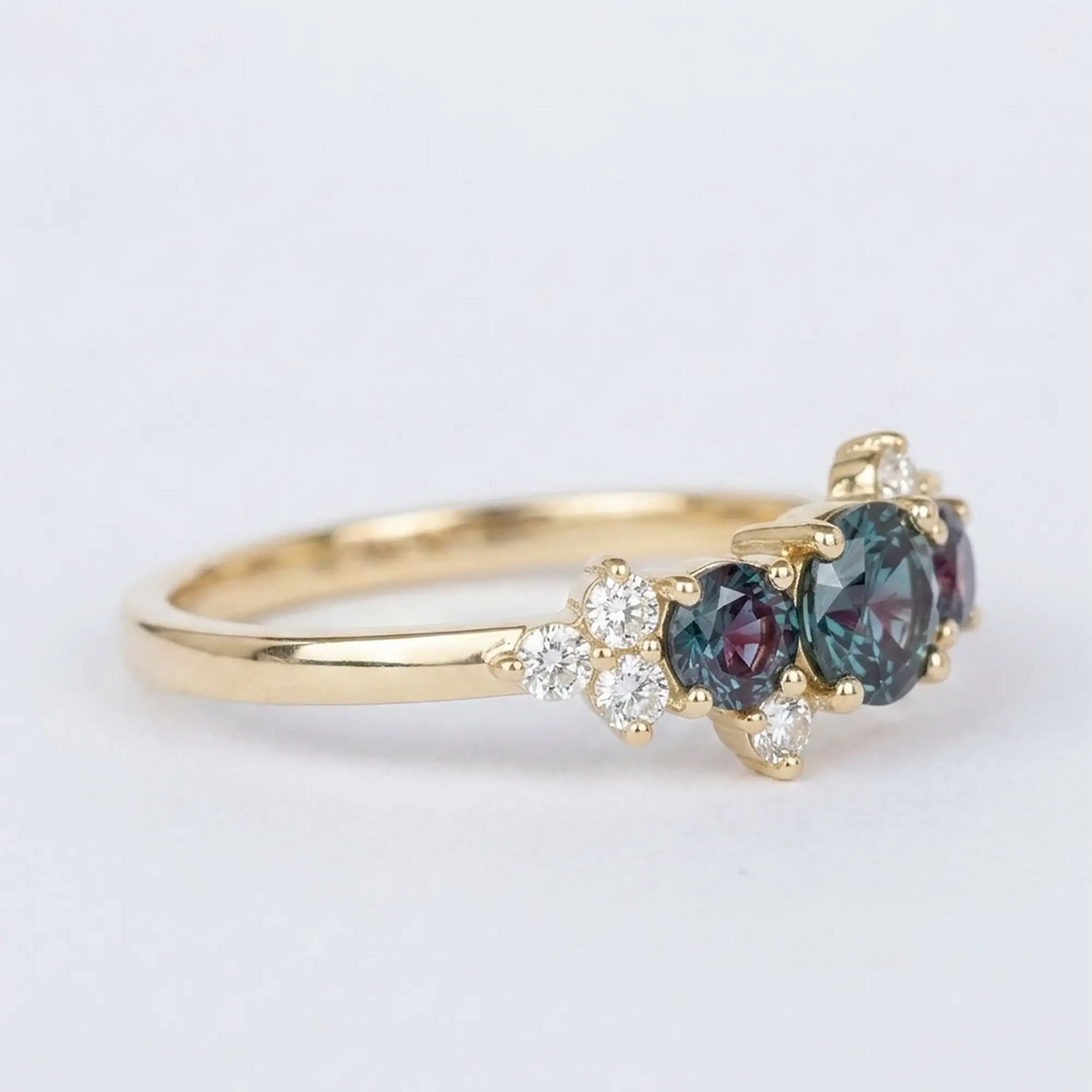 Side view profile of alternative bridal alexandrite ring highlighting low-profile stone setting