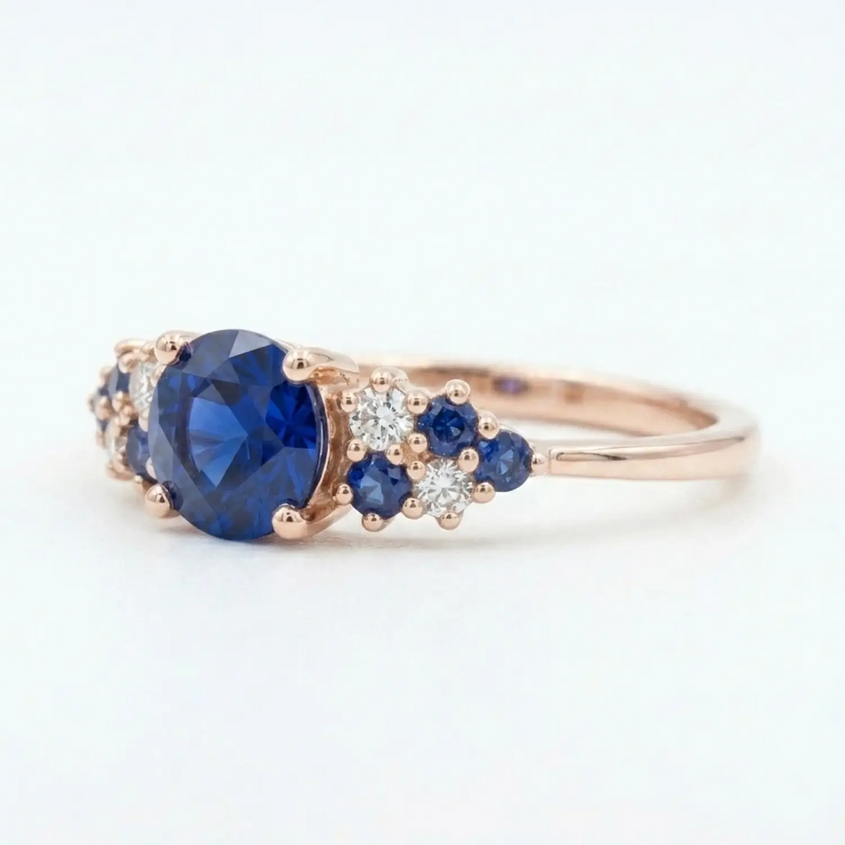 Unique alternative bridal gemstone ring with multi-prong cluster setting in solid gold.