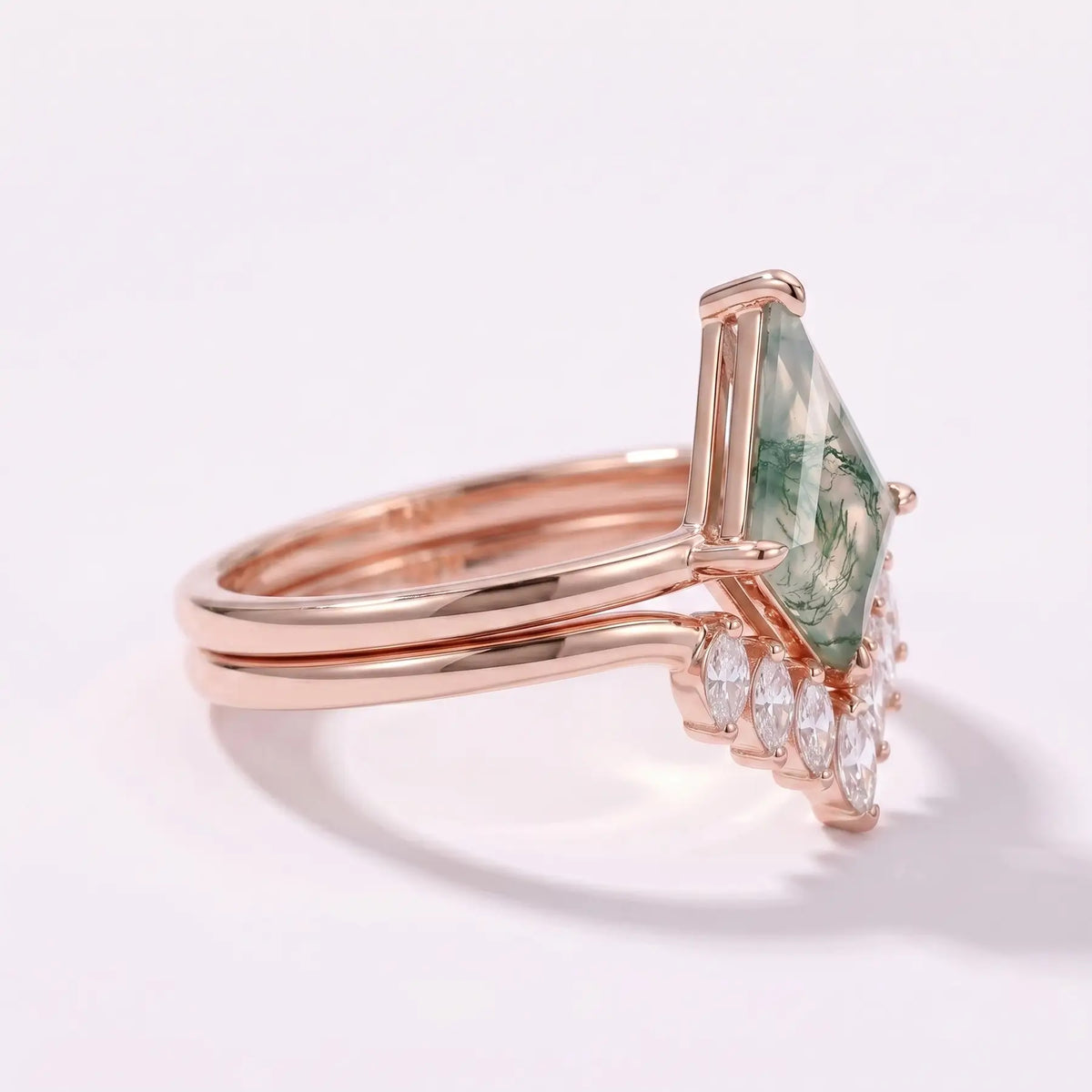Side profile view of nested kite moss agate ring set showcasing flush alignment and secure prong craftsmanship