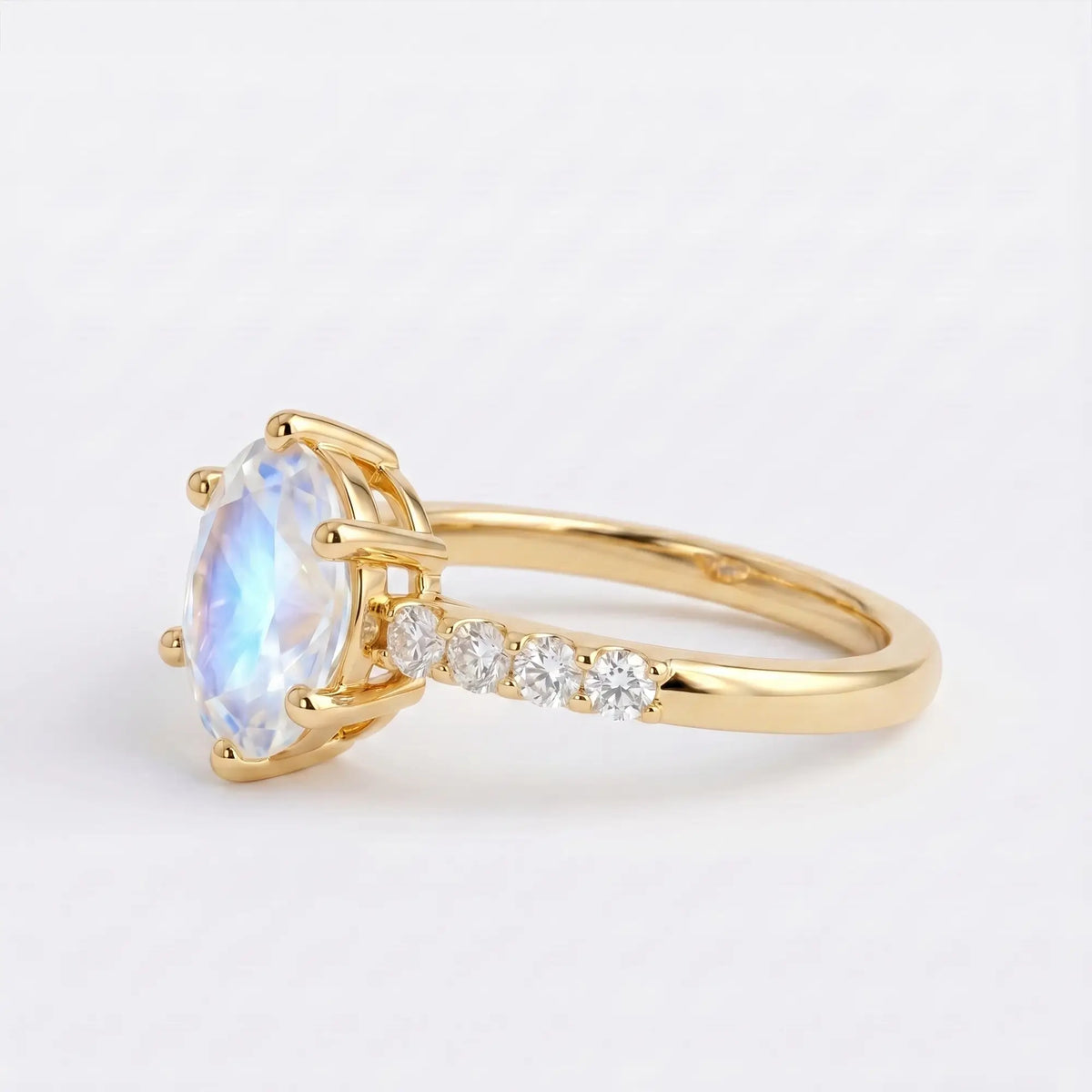 Artisanal gold ring featuring a 6-prong oval natural moonstone and delicate micro pavé band detail