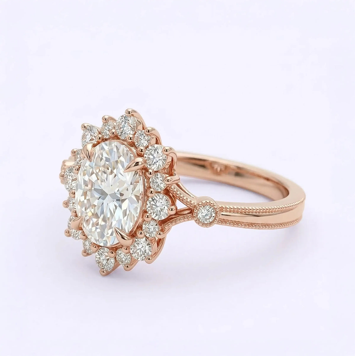 Artisanal gold engagement ring featuring oval moissanite with unique layered halo layout