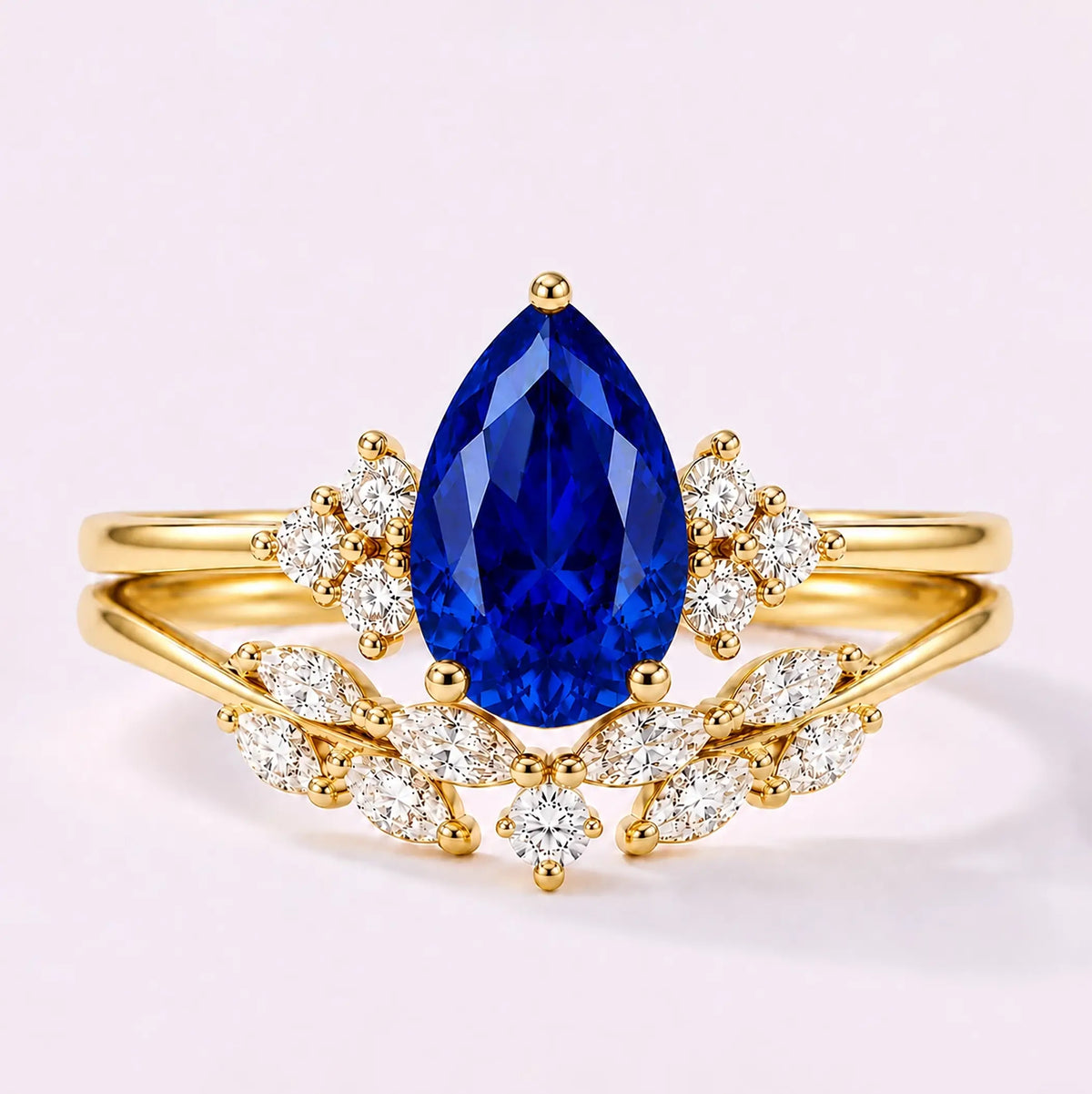 Pear cut sapphire cluster bridal ring set with marquise wedding band in yellow gold