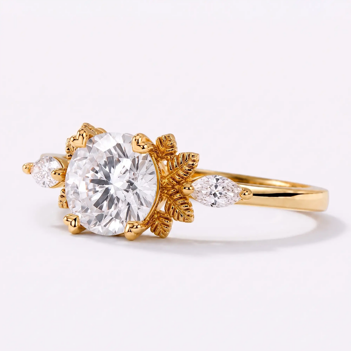 Left view of round moissanite engagement ring featuring delicate leaf details and marquise accents