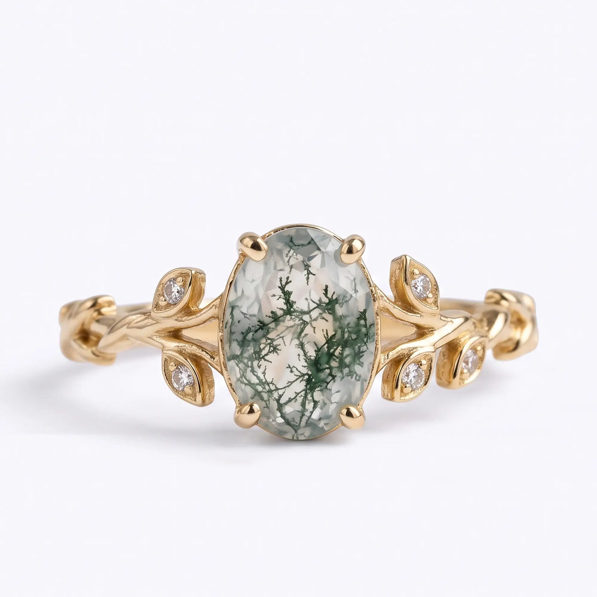 Oval moss agate asymmetrical leaf engagement ring with round moissanite accents