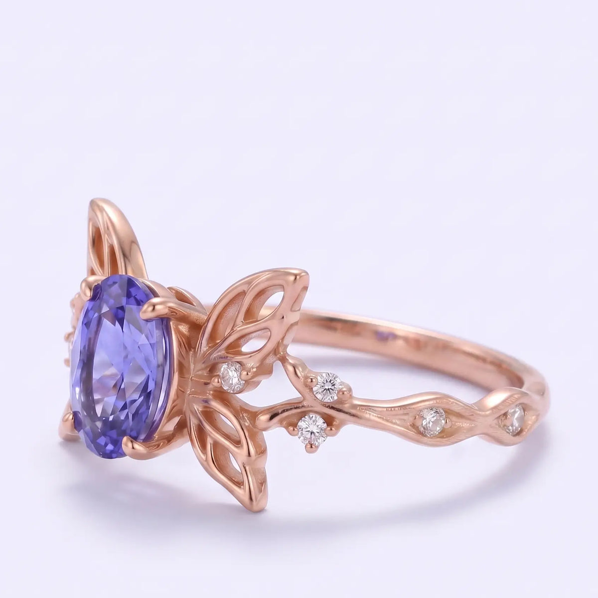 Openwork butterfly engagement ring with round moissanite accents