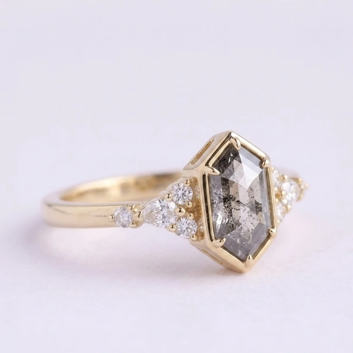 Side view profile of alternative bridal salt and pepper diamond ring highlighting low-profile bezel setting