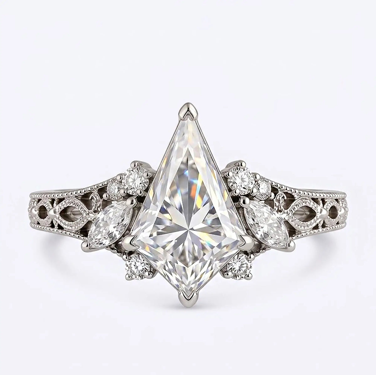 Edwardian-inspired kite cut moissanite cluster engagement ring with marquise and round accents