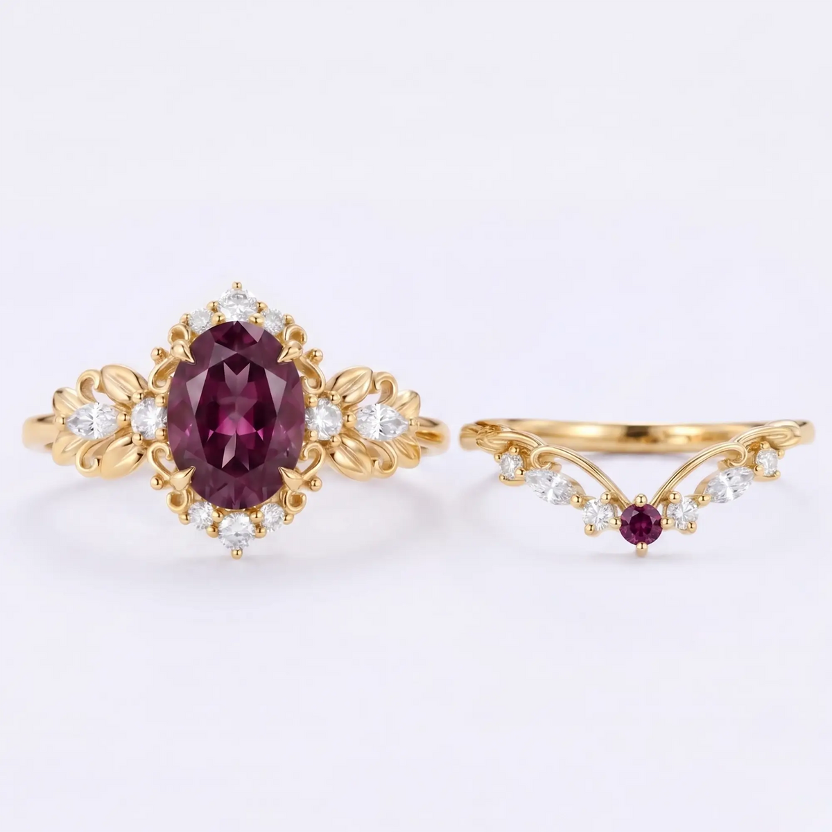 Detailed close-up view of a 6x8mm oval-cut lab alexandrite engagement ring featuring intricate carved gold leaf details and round brilliant side clusters