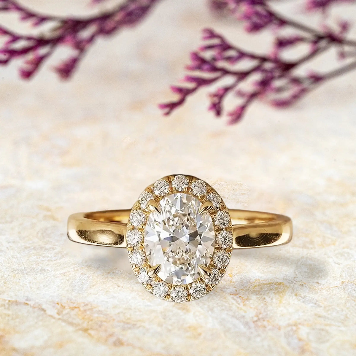 Oval moissanite halo engagement ring in yellow gold classic diamond design for women