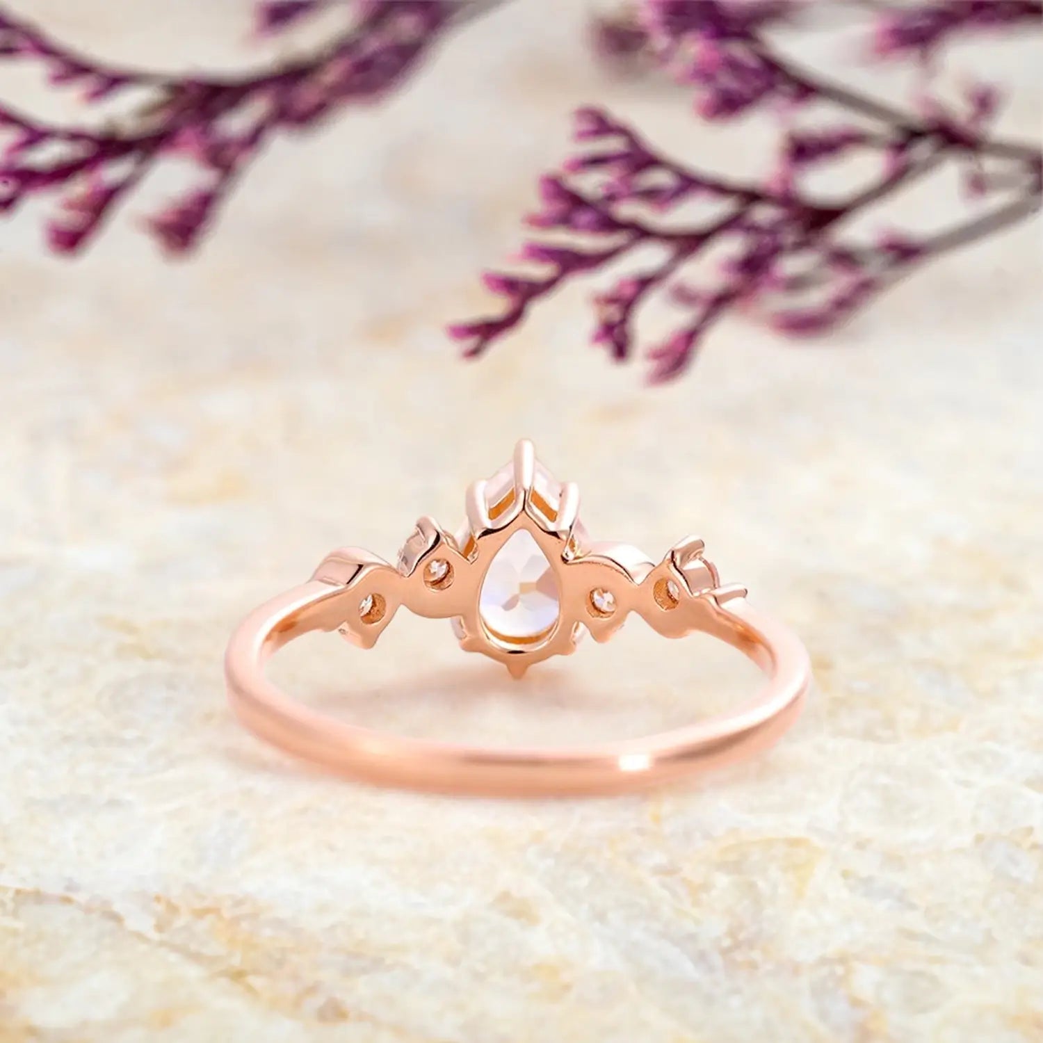 pear-moonstone-engagement-ring-five-stone-rose-gold-twist-band-jewelry