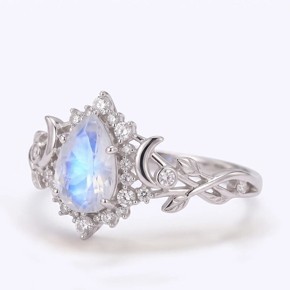 Celestial engagement ring with pear moonstone and crescent moon details